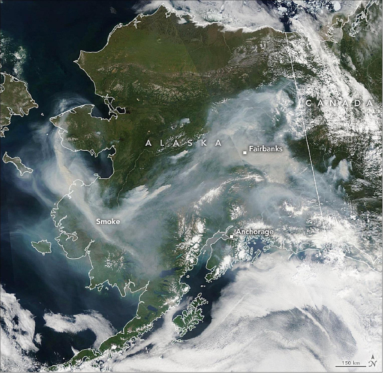 Figure 27: The MODIS instrument on NASA's Aqua satellite captured an image of thick wildfire smoke swirling over the state on 8 July 2019. Meteorologists in Fairbanks reported visibility had dropped to less than one mile due to smoke, and air quality sensors in the city reported skyrocketing levels of particulates in the air (image credit: NASA Earth Observatory, image by Lauren Dauphin, using MODIS data from NASA EOSDIS/LANCE and GIBS/Worldview and GEOS-5 data from the Global Modeling and Assimilation Office at NASA GSFC. Story by Adam Voiland)