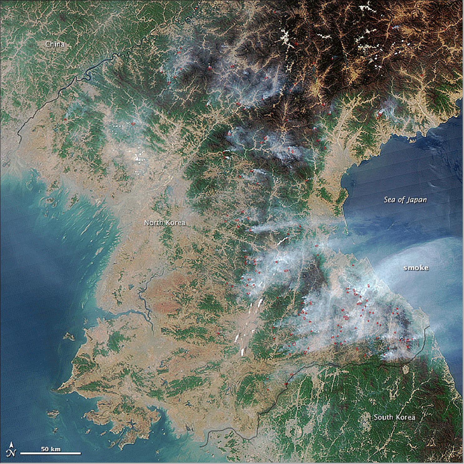 Figure 129: Actively burning areas, as viewed by NASA’s Aqua satellite on April 25, 2014, are outlined in red. Fields and grasslands appear light brown. Forests at lower elevations appear green; at higher elevations, forests are still brown at this time of year (image credit: NASA Earth Observatory)