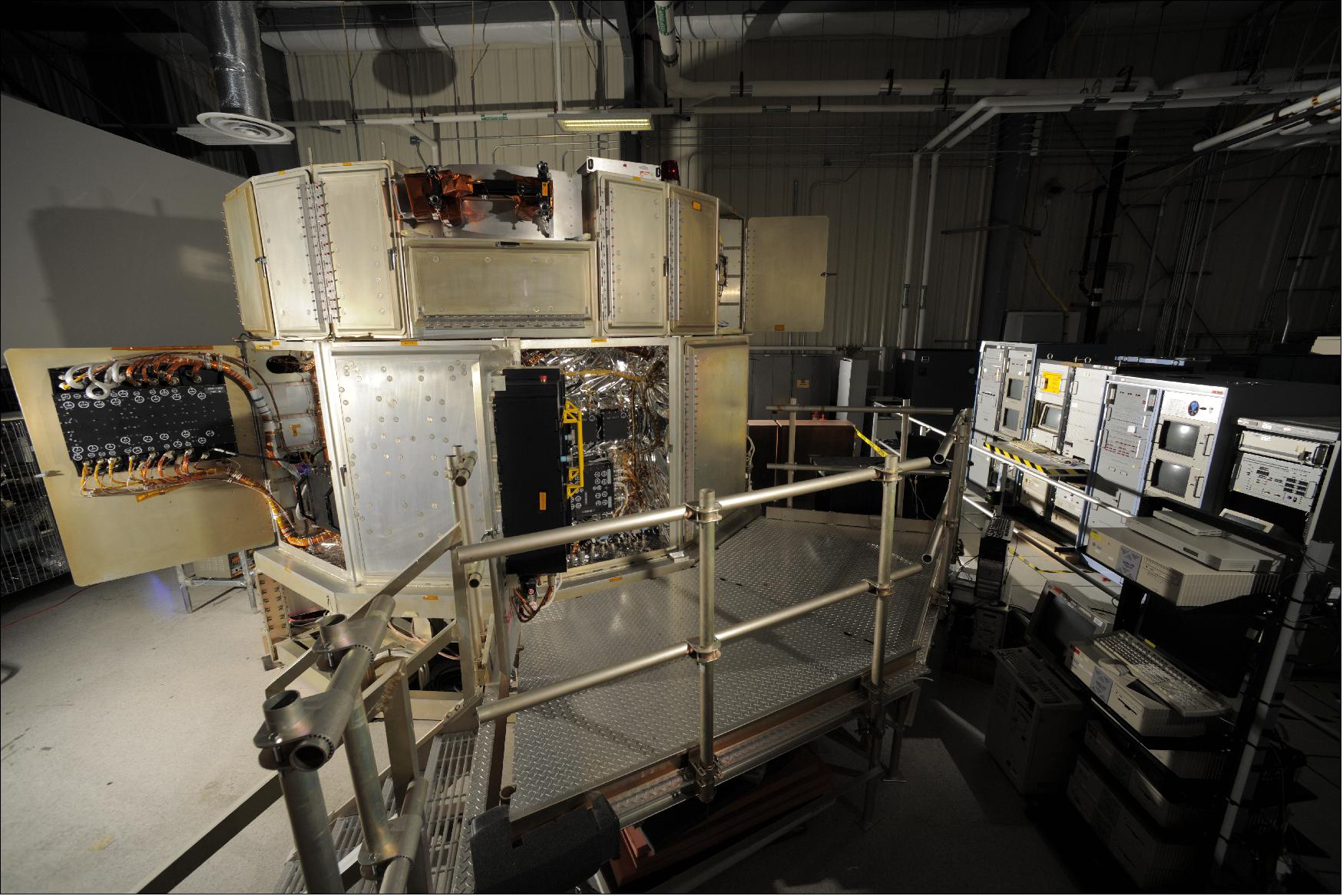 Figure 76: The VEST facility uses both hardware and software simulators to replicate the operation of the Hubble observatory in orbit. In this view, the main VEST structure is seen on the left, while ancillary equipment, including some of the instrument benches, appear on the right (image credit: NASA)