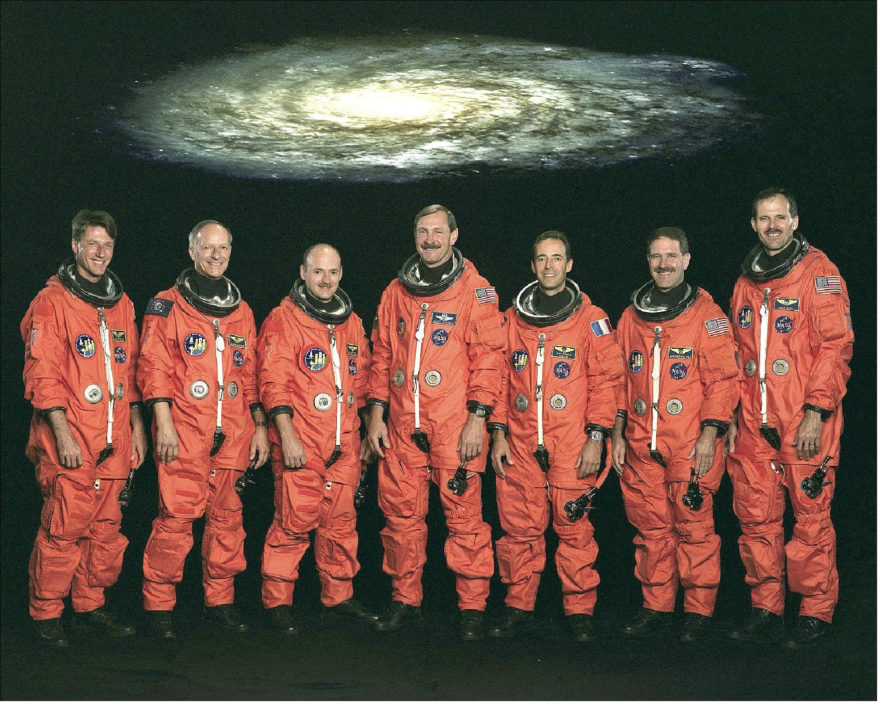 Figure 58: STS-103 Crew photo with Commander Curtis L. Brown, Pilot Scott J. Kelly, Mission Specialists Steven L. Smith, C. Michael Foale, John M. Grunsfeld, Claude Nicollier and Jean-Francois Clervoy (image credit: NASA) 86)
