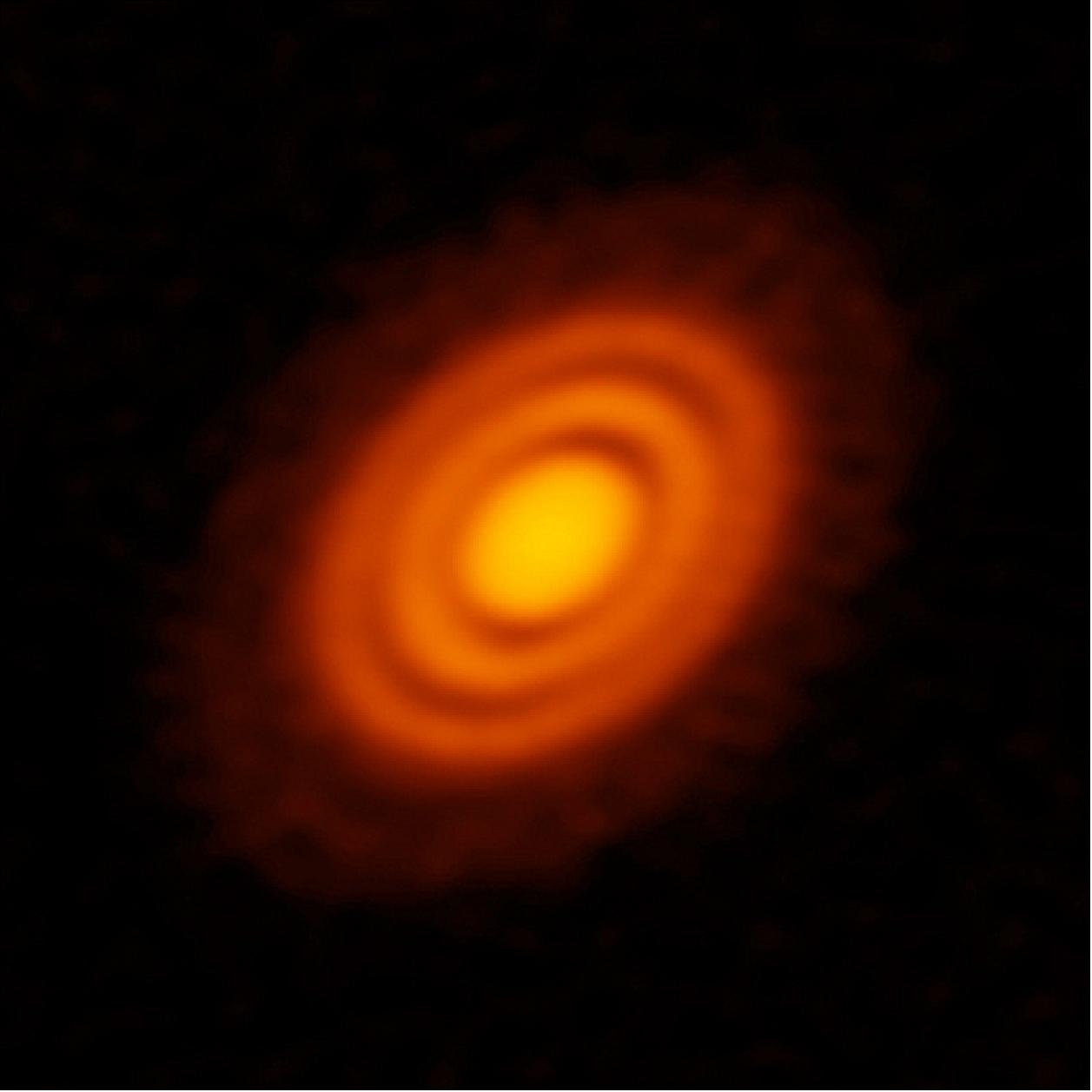 Figure 43: ALMA image of the protoplanetary disk surrounding the young star HD 163296 as seen in dust. New observations suggested that two planets, each about the size of Saturn, are in orbit around the star. These planets, which are not yet fully formed, revealed themselves by the dual imprint they left in both the dust and the gas portions of the star's protoplanetary disk [image credit: ALMA (ESO/NAOJ/NRAO); A. Isella; B. Saxton (NRAO/AUI/NSF)]