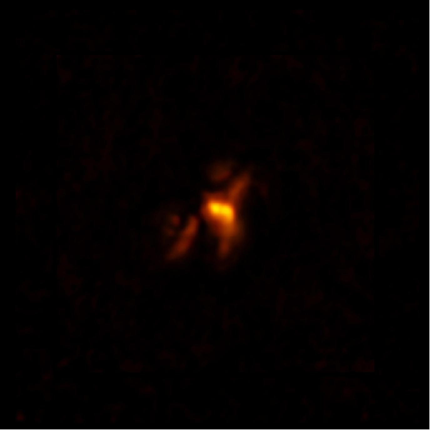 Figure 39: ALMA image of cold molecular gas at the heart of the Phoenix Cluster. The filaments extending from the center hug enormous radio bubbles created by jets from a supermassive black hole. This discovery sheds light on the complex relationship between a supermassive black hole and its host galaxy [image credit: ALMA (ESO/NAOJ/NRAO), H. Russell et al.; B. Saxton (NRAO/AUI/NSF)]