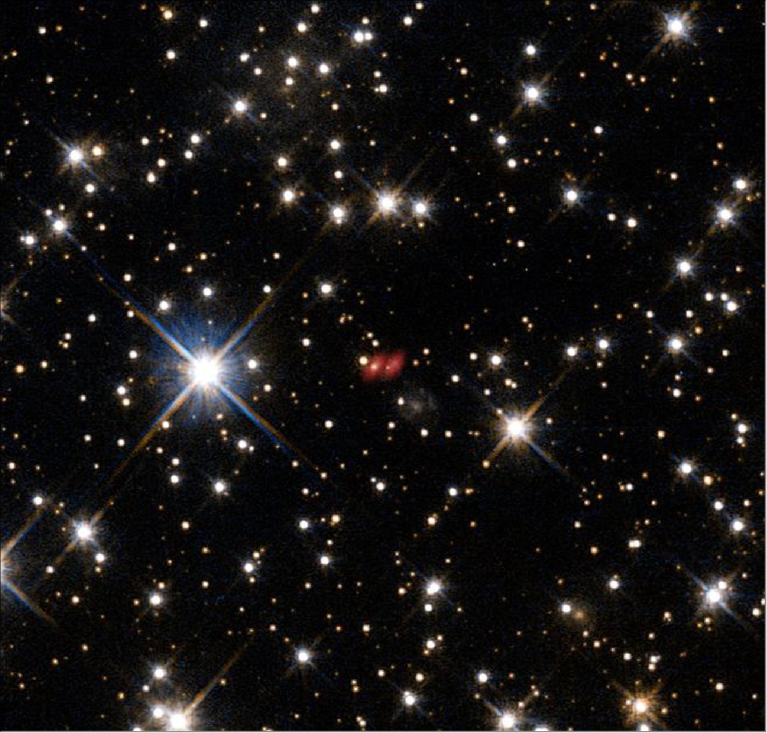 Figure 61: This image from the NASA/ESA Hubble Space Telescope shows the distant active galaxy PKG 1830-211. It shows up as an unremarkable looking star-like object, hard to spot among the many much closer real stars in this picture. Recent ALMA observations show both components of this distant gravitational lens and are marked in red on this composite picture (image credit: ALMA (ESO/NAOJ/NRAO), NASA/ESA, I. Martí-Vidal) 76)