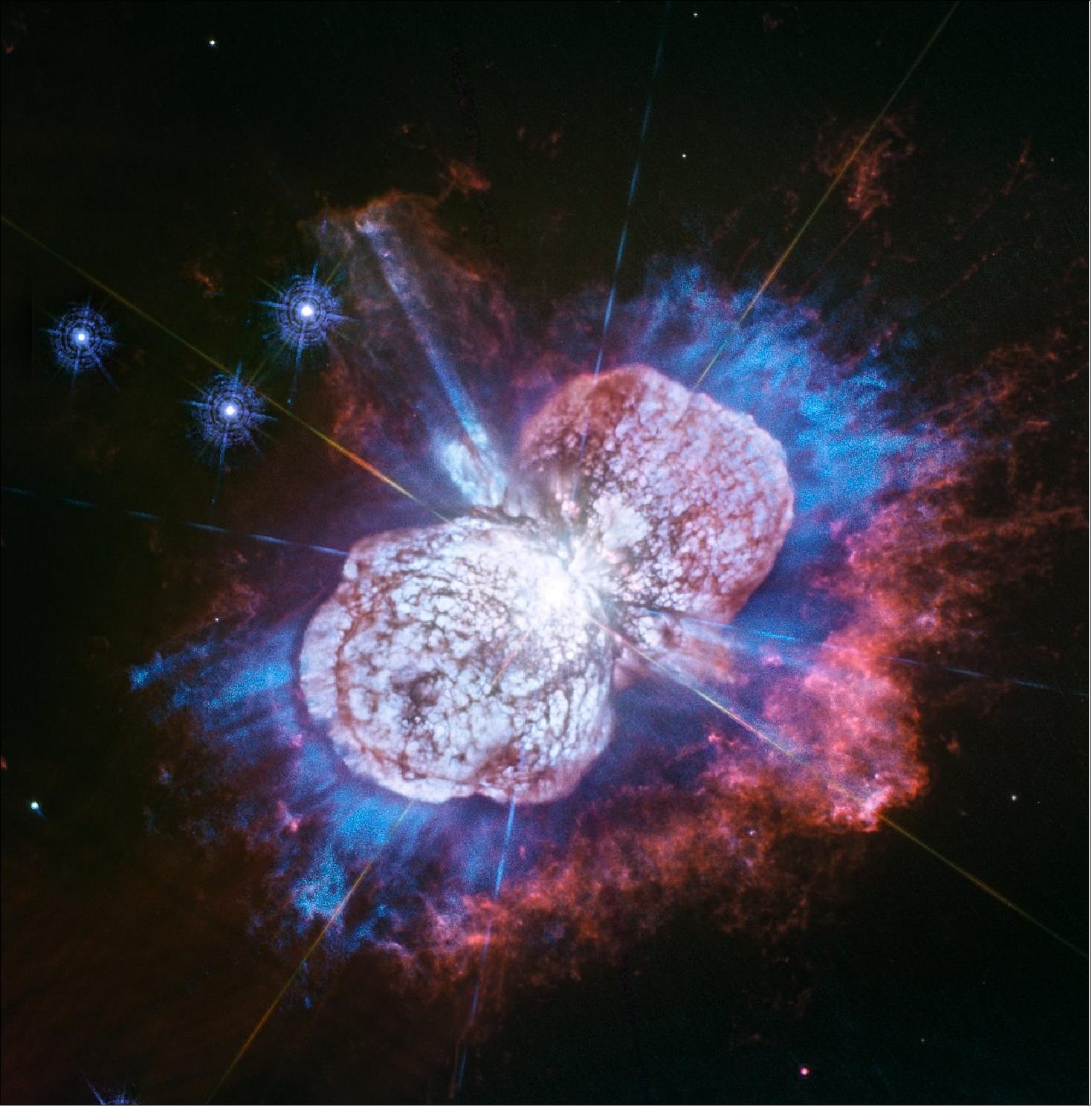 Figure 41: Hubble offers a special view of the double star system Eta Carinae’s expanding gases glowing in red, white, and blue. This is the highest resolution image of Eta Carinae taken by the NASA/ESA Hubble Space Telescope [image credit: NASA/ESA, N. Smith (University of Arizona, Tucson), and J. Morse (BoldlyGo Institute, New York)]