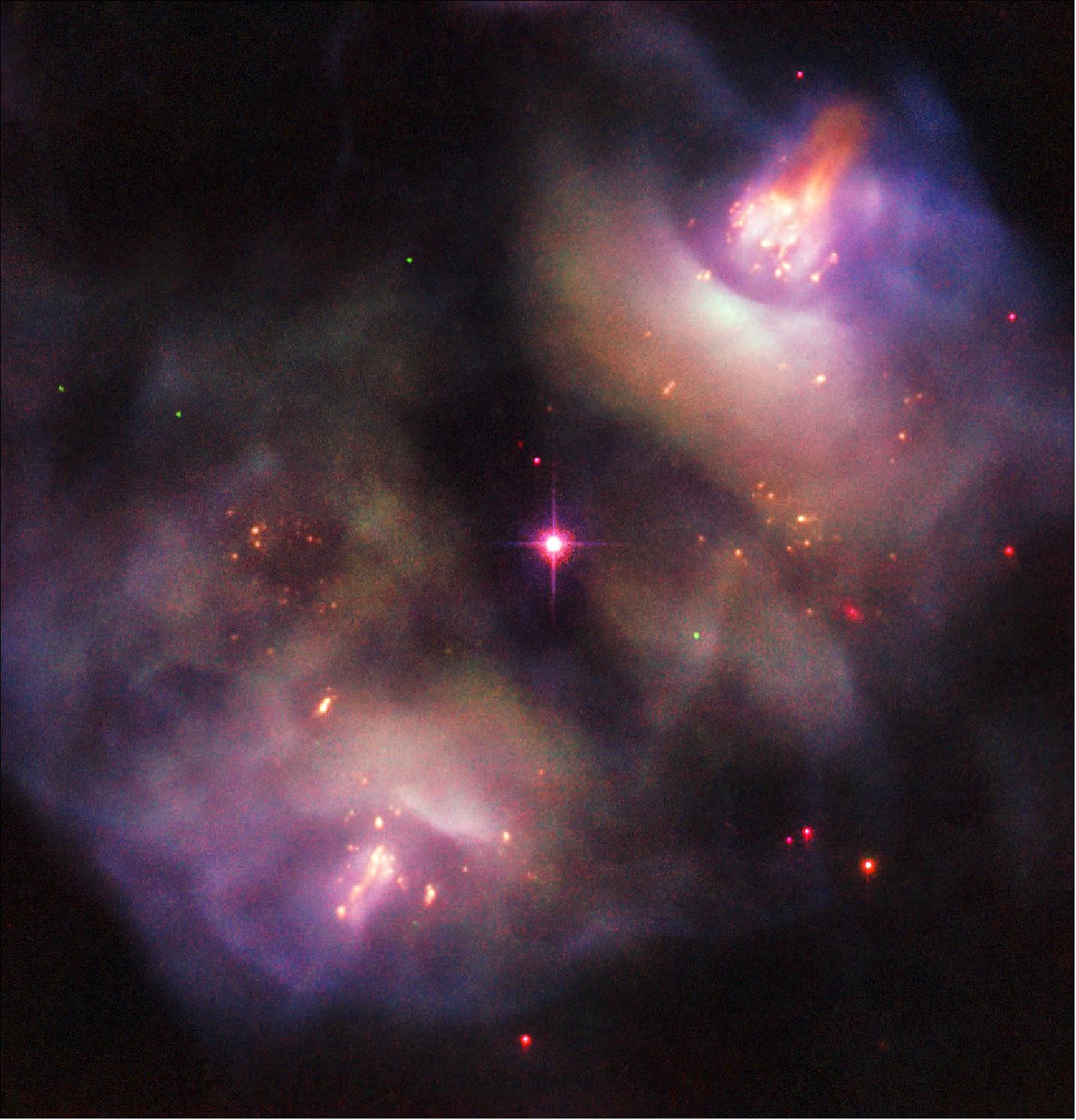 Figure 30: Two lobes are visible to the upper right and lower left of the frame, and together form something known as a planetary nebula. Despite the name, such nebulae have nothing to do with planets; NGC 2371/2 formed when a Sun-like star reached the end of its life and blasted off its outer layers, shedding the constituent material and pushing it out into space to leave just a superheated stellar remnant behind. This remnant is visible as the orange-tinted star at the center of the frame, sitting neatly between the two lobes (image credit: ESA/Hubble & NASA, R. Wade et al.; CC BY 4.0)