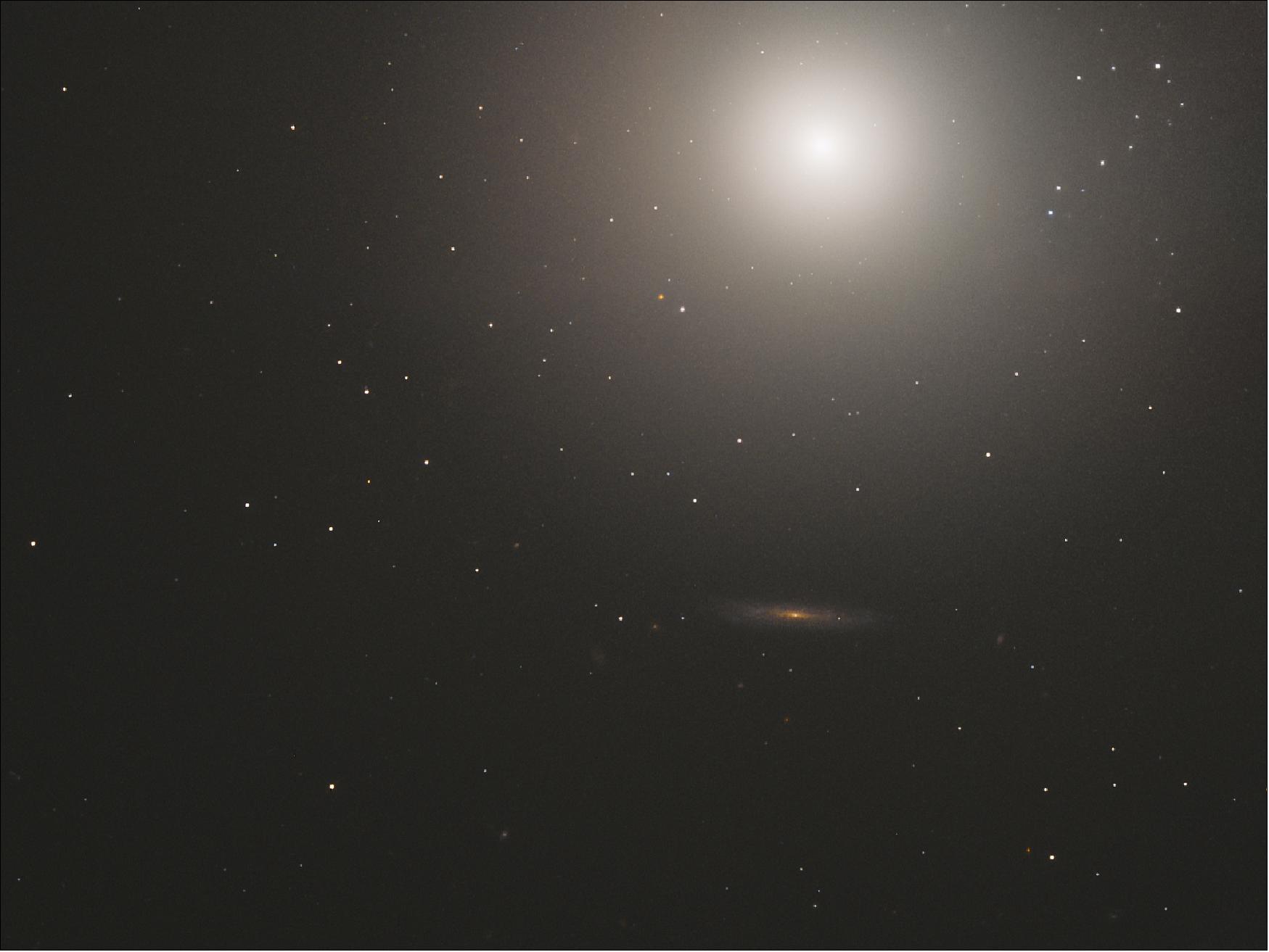 Figure 79: This huge ball of stars — around 100 billion in total — is an elliptical galaxy located some 55 million light-years away from us. Known as Messier 89, this galaxy appears to be perfectly spherical; this is unusual for elliptical galaxies, which tend to be elongated ellipsoids. The apparently spherical nature of Messier 89 could, however, be a trick of perspective, and be caused by its orientation relative to the Earth (image credit: ESA/Hubble & NASA, S. Faber, et al.)