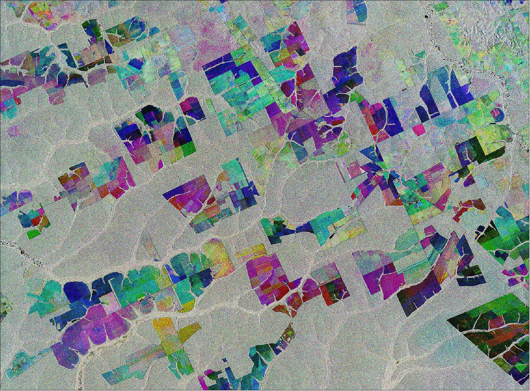 Figure 1: This image combines three separate radar images from the Copernicus Sentinel-1 mission taken about two years apart to show change in crops and land cover over time. Unlike images from satellites carrying optical or ‘camera-like’ instruments, images acquired with imaging radar are interpreted by studying the intensity of the backscatter radar signal, which is related to the roughness of the ground. - Here, the first image, from 2 May 2015, is picked out in blue; the second, from 16 March 2017, picks out changes in green; and the third from 18 March 2019 in red; areas in grey depict little or no change between 2015 and 2019. This image is also featured on the Earth from Space video program (image credit: ESA, the image contains modified Copernicus Sentinel data (2015-19), processed by ESA, CC BY-SA 3.0 IGO)