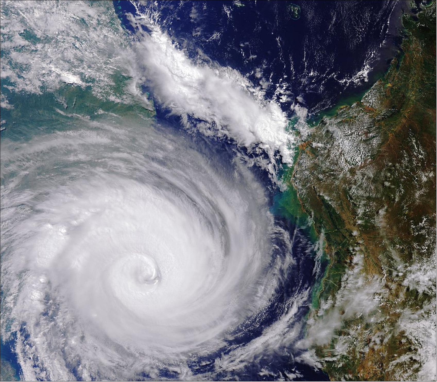 Figure 26: Captured by the Copernicus Sentinel-3 mission, this image shows Cyclone Idai on 13 March 2019 west of Madagascar and heading for Mozambique. Here, the width of the storm is around 800–1000 km, but does not include the whole extent of Idai. The storm went on to cause widespread destruction in Mozambique, Malawi and Zimbabwe. With thousands of people losing their lives, and houses, roads and croplands submerged, the International Charter Space and Major Disasters and the Copernicus Emergency Mapping Service were triggered to supply maps of flooded areas based on satellite data to help emergency response efforts (image credit: ESA, the image contains modified Copernicus Sentinel data (2019), processed by ESA)