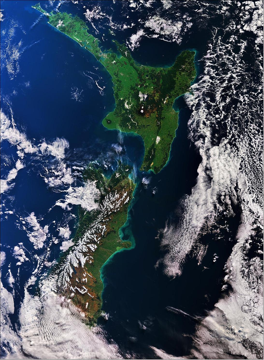 Figure 19: This true color image of New Zealand, captured on 22 August 2018 with Sentinel-3A, shows the snow-covered Southern Alps stretching 500 km across the west coast of the South Island. This image is also featured on the Earth from Space video program (image credit: ESA, the image contains modified Copernicus Sentinel data (2018), processed by ESA, CC BY-SA 3.0 IGO)