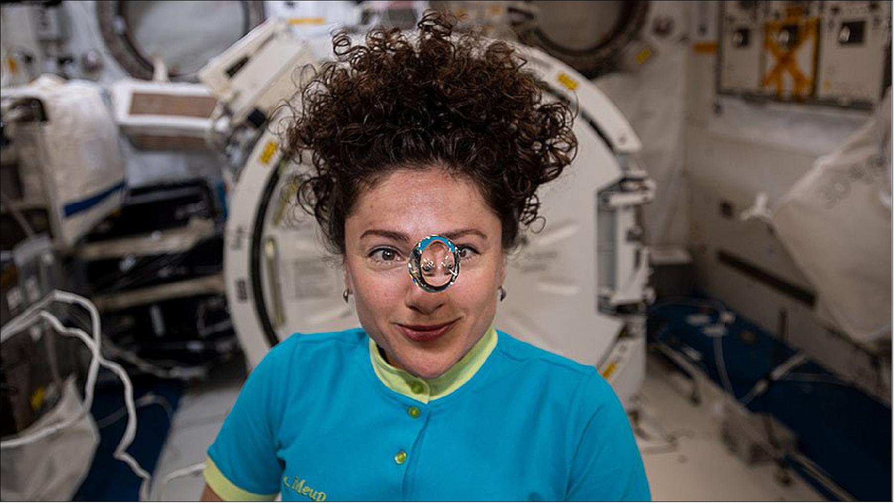 Figure 6: NASA astronaut Jessica Meir observes a floating sphere of water formed by microgravity (image credit: NASA)