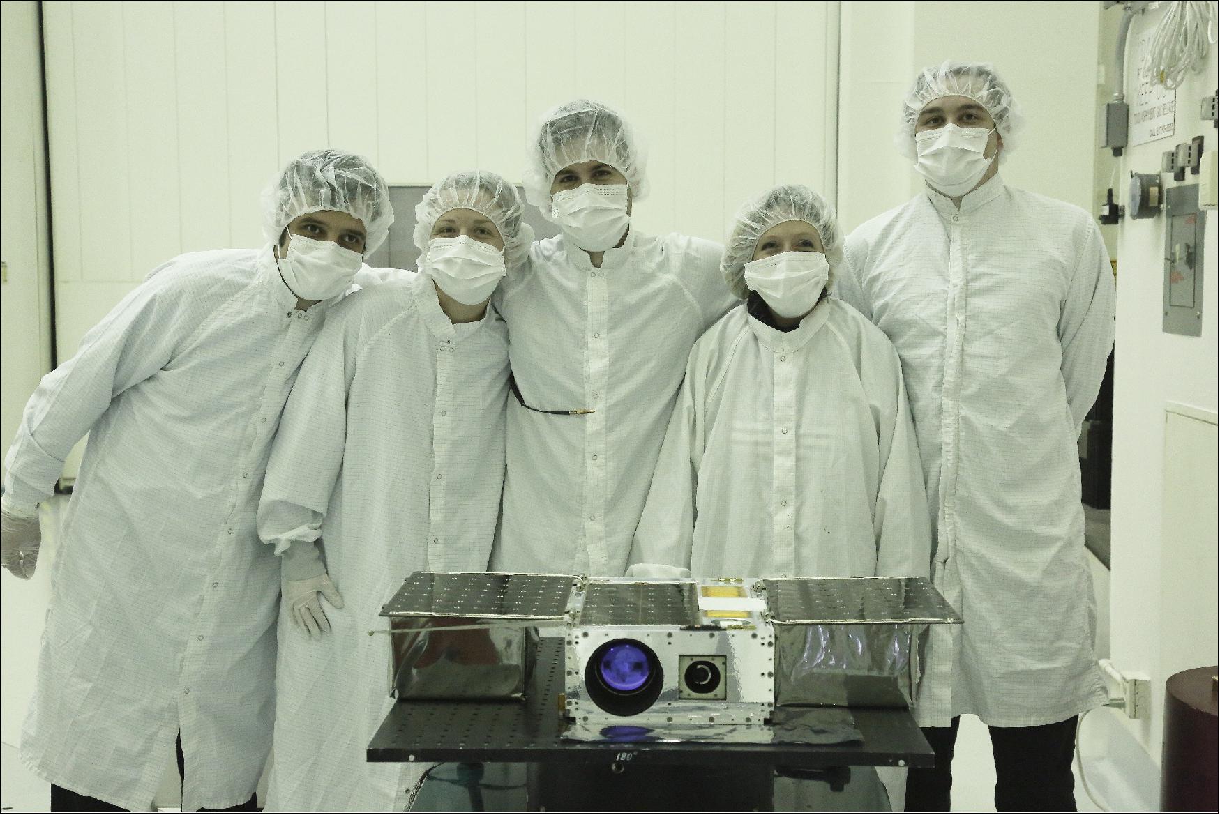 Figure 7: Members of the ASTERIA team prepare the petite satellite for its journey to space (from left to right: Robert Bocchino, Amanda Donner, Cody Colley, Alessandra Babuscia, and Peter Di Pasquale), image credit: NASA/JPL-Caltech)