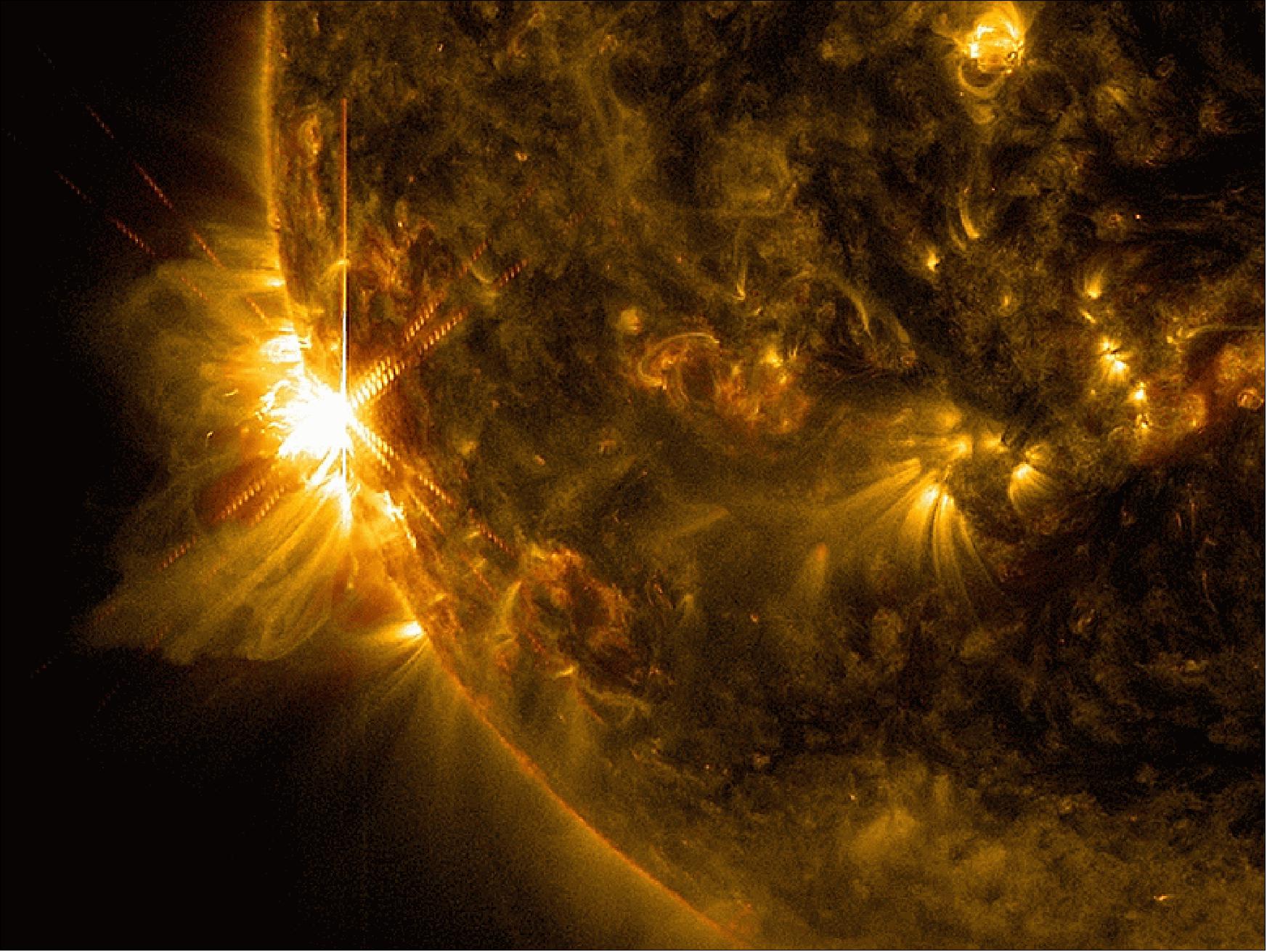 Figure 22: A solar flare bursts off the left limb of the sun in this image captured by SDO on June 10, 2014, at 11.42 UTC. This is classified as an X 2.2 flare, shown in a blend of two wavelengths of light: 171 and 131 Ä, colorized in gold and red, respectively (image credit: NASA, SDO)