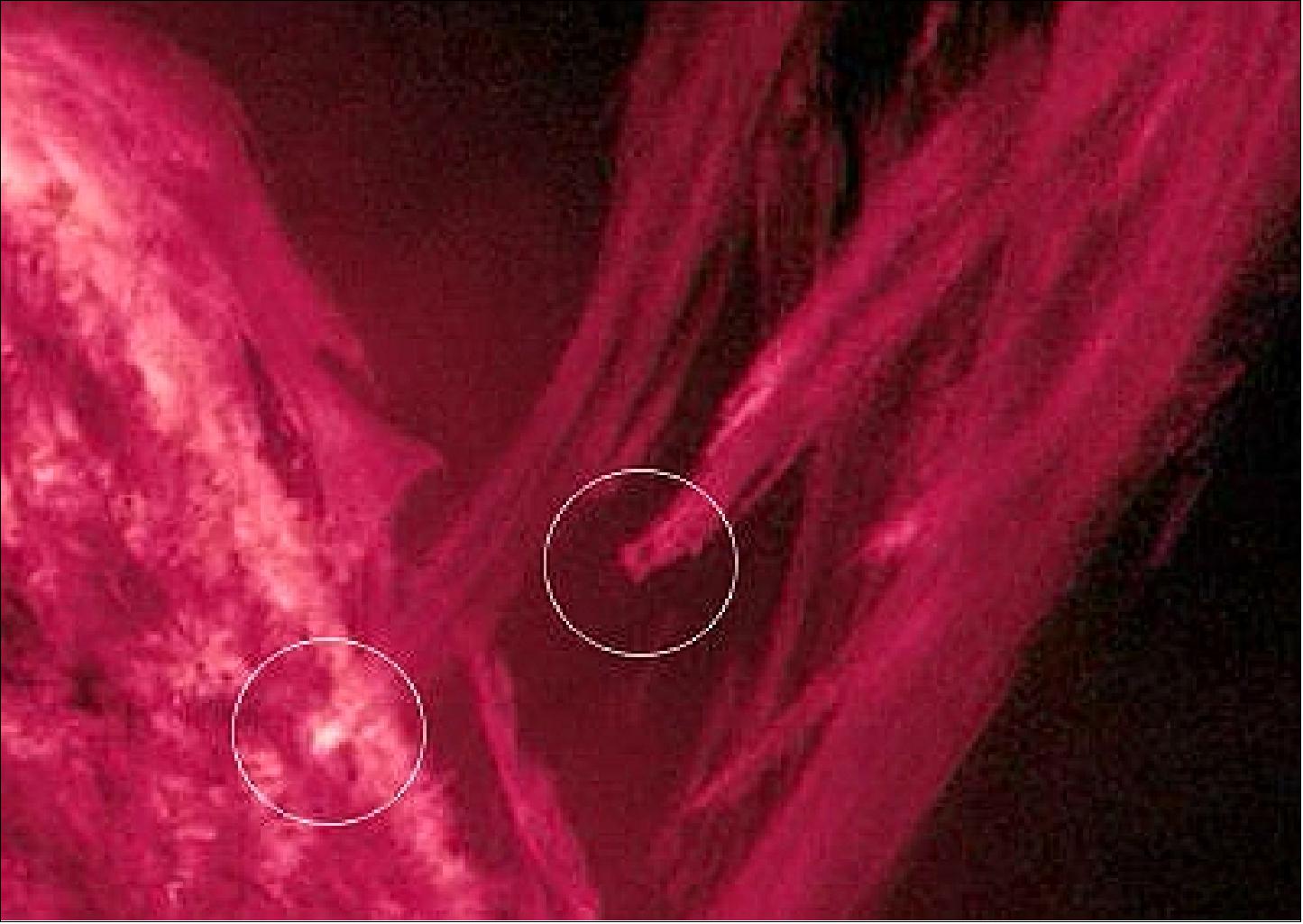 Figure 37: Coronal rain. Encircled are two plasma streamers, one hitting the sun's surface and another incoming behind it (image credit: NASA)