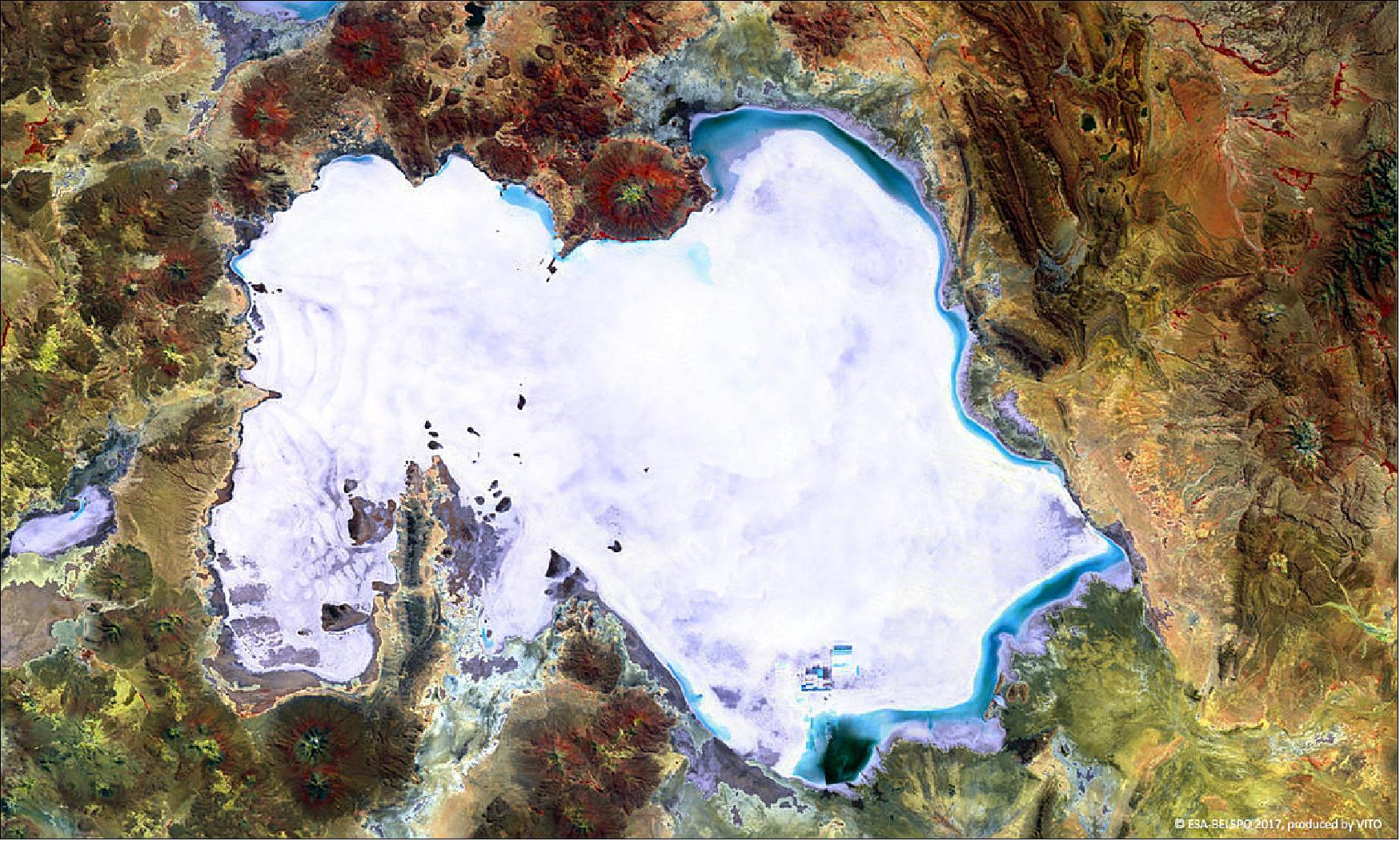 Figure 34: The false-color PROBA-V image was acquired on 5 April 2017. On the western side of the Salar de Uyuni, some wavy patterns are visible, while blue shades on the northern and eastern edges indicate flooded areas. The small rectangular patches to the south of the salt flat indicate a large lithium mining area (image credit: ESA/Belspo – produced by VITO)