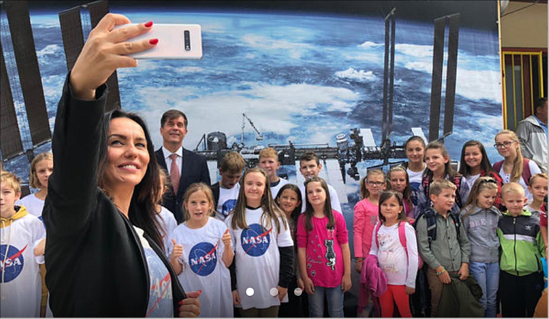 Figure 12: On Sept. 23, 2019, Eric Nelson, the U.S. Ambassador to Bosnia and Herzegovina, presented a framed letter to the Snezana Ruzucic, mayor of the Balkan municipality of Jezero. The letter, from NASA's director of Mars Exploration, James Watzin, honored the connection between the small Balkan town and Jezero Crater the landing site of NASA's upcoming Mars 2020 mission. In this picture, Ruzucic snaps a selfie of the ambassador with local school children (image credit: US Embassy Sarajevo)