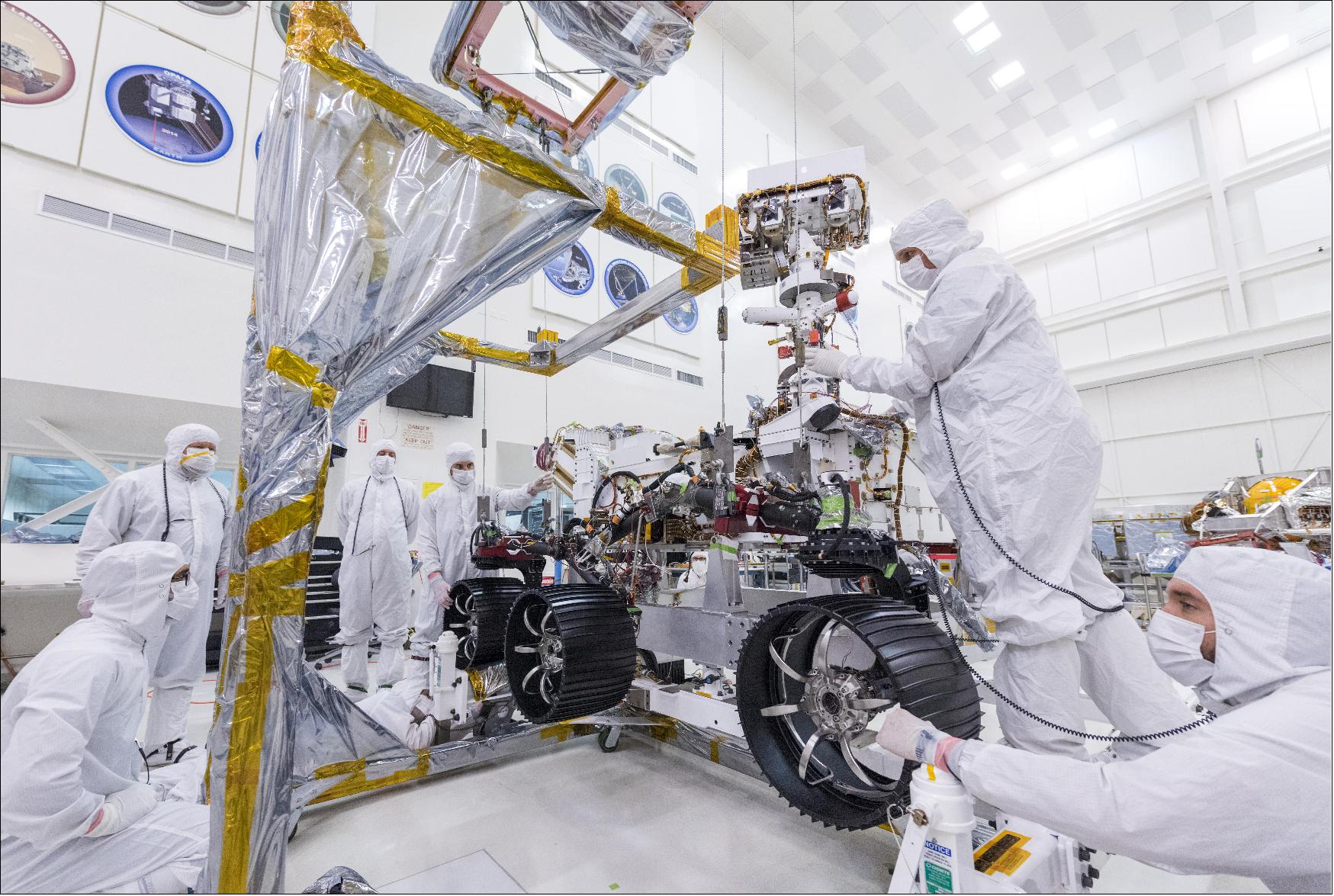 Figure 7: In this image, taken on June 13, 2019, engineers at JPL install the starboard legs and wheels - otherwise known as the mobility suspension - on the Mars 2020 rover (image credit: NASA/JPL-Caltech)