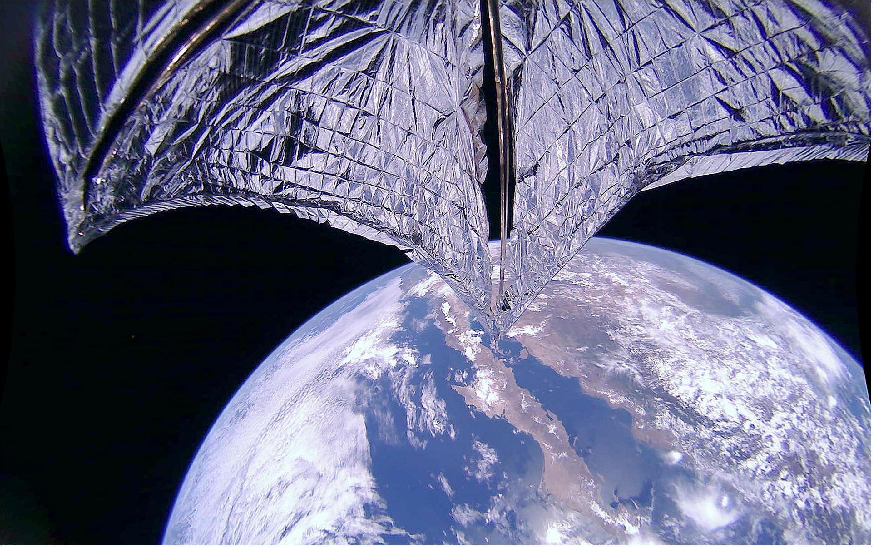 Figure 14: This image was taken during the LightSail-2 sail deployment sequence on 23 July 2019 at 11:48 PDT (18:48 UTC). Baja California and Mexico are visible in the background. LightSail-2's dual 185º fisheye camera lenses can each capture more than half of the sail. This image has been de-distorted and color corrected (image credit: The Planetary Society)