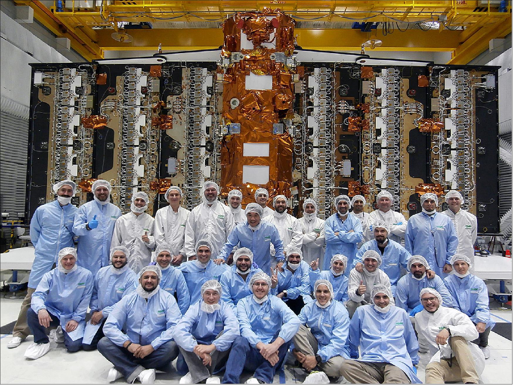 Figure 4: Photo of the SAOCOM-1A sapcecraft along with members of the integration teams (image credit: CONAE)
