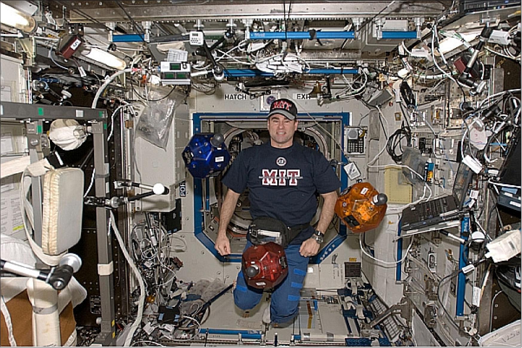 Figure 34: Astronaut Gregory Chamitoff, an MIT alumnus, is attending a SPHERES formation flight test (image credit: MIT)