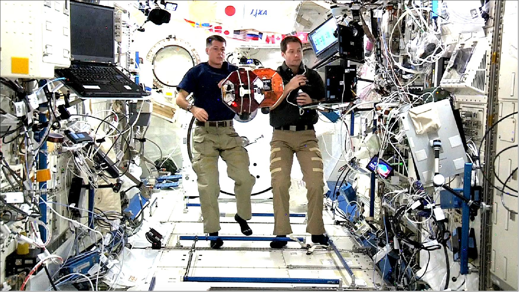 Figure 26: Commander Shane Kimbrough and ESA Astronaut Thomas Pesquet running a test on SPHERES - Tether Demonstration; Expedition 50 (image credit: NASA Ames)
