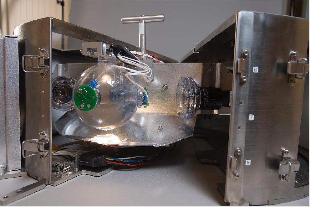 Figure 22: This image shows the FLUIDICS experiment equipment featuring one of the three transparent spheres. The investigation evaluates the phenomena of liquid sloshing and surface wave turbulence in a spacecraft fuel tank (image credit: CNES)