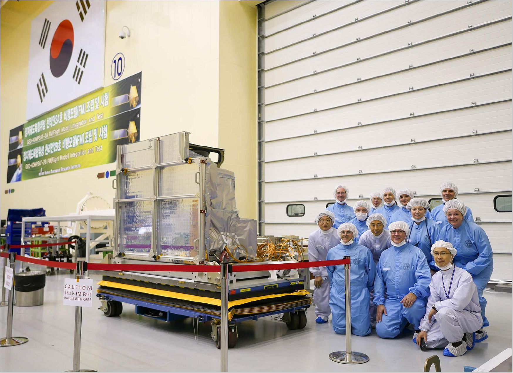 Figure 13: KARI and Harris Corporation employees pose with the Advanced Meteorological Imager, which was built by Harris in Fort Wayne, Ind., and was recently delivered to KARI for integration into its newest weather satellite (image credit: Harris Corporation)
