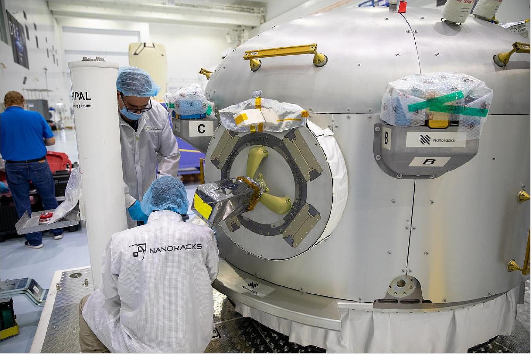 Figure 6: The NanoRacks Team prepares the Bishop Airlock for final inspections at NASA’s Kennedy Space Center’s Space Station Processing Facility (SSPF) in October, 2020 (image credit: NanoRacks)
