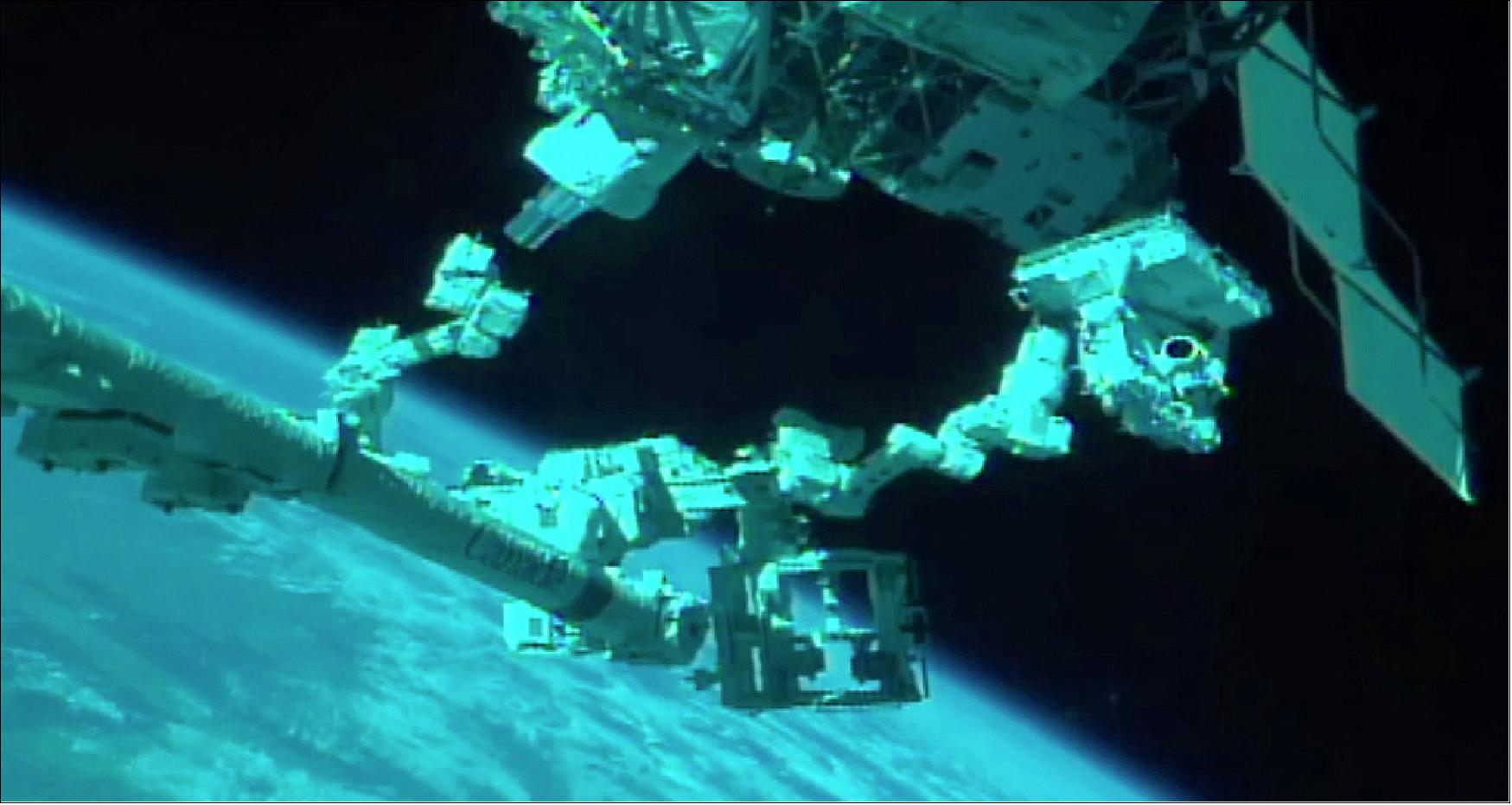 Figure 5: MUSES being installed on the External Logistics Carrier (ELC-4) by the robotic arm (image credit: TBE, NASA)