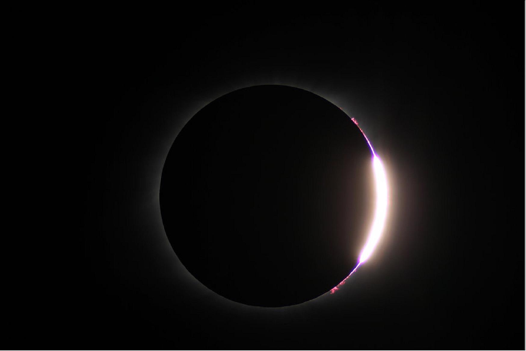 Figure 24: This snapshot was captured during an eclipse expedition to the USA as part of ESA's CESAR (Cooperation through Education in Science and Astronomy Research) educational initiative. CESAR engages students in the wonders of science and technology – astronomy in particular. The expedition team organized a special event on eclipse day, and delivered a broadcast including eclipse footage and talks with experts. Totality for the team occurred at precisely 10:42 local time in Casper, Wyoming (17:42 GMT); this image was taken moments after totality ended and the Moon continued along its path through the sky (image credit: ESA, CC BY-SA 3.0 IGO)