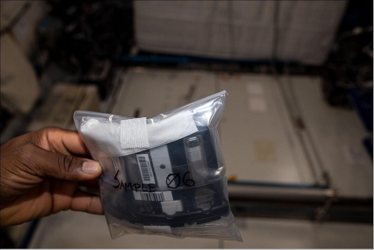 Figure 16: Packing foam. NASA astronaut Victor Glover takes a picture of a sample cell packed for return to Earth from the International Space Station. The Sample Cell Unit S/N 6 of the Foam Coarsening experiment was used for commissioning on the International Space Station. It contains three sample cells filled with liquid. By shaking the pistons inside the cell (the white and black items at the bottom of the cells are the most visible parts of the pistons), foam is generated. The white cell (in third position) contains a humidity sensor (image credit: NASA)