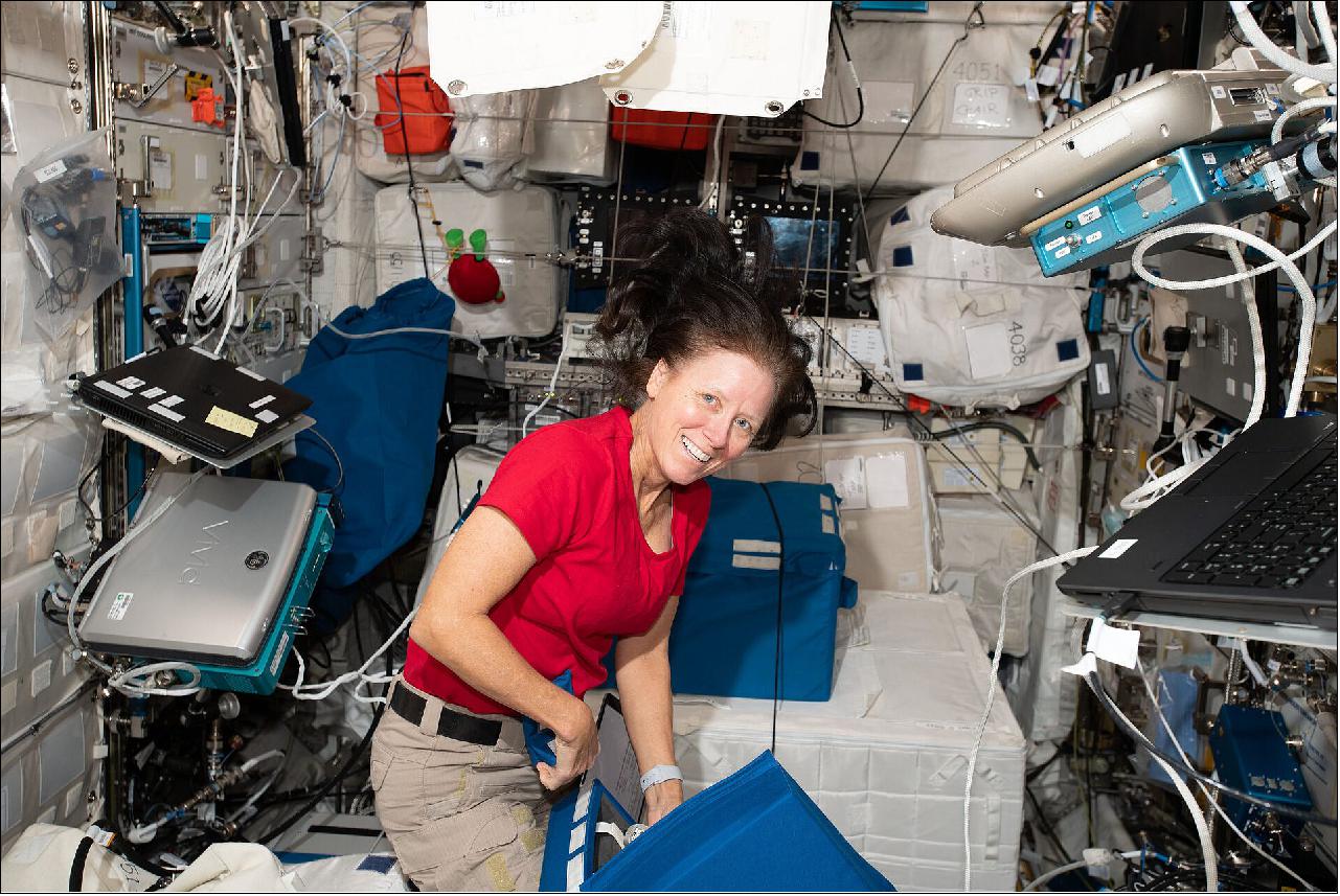 Figure 12: NASA astronaut Shannon Walker works on transferring cargo, including new scientific investigations, from a Dragon cargo craft into the International Space Station's European Columbus module, December 2021 (image credit: NASA)