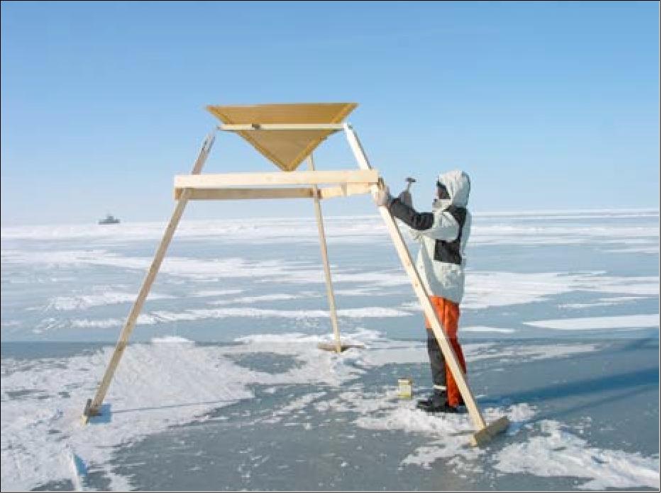 Figure 5: Corner reflector being erected on Bay of Bothnia sea ice on March 14th 2005 (image credit: AWI)