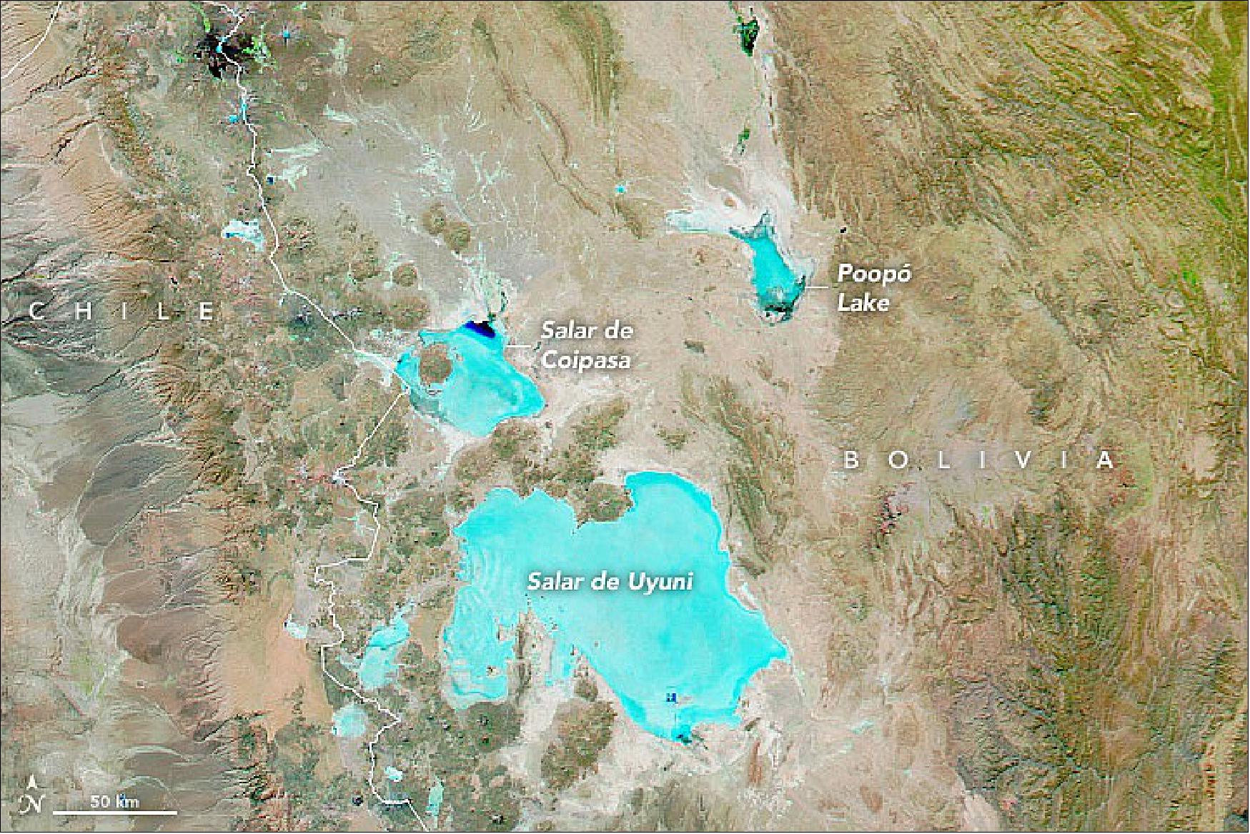 Figure 35: This false-color image was acquired by NASA’s Aqua satellite on August 22, 2021, using the MODIS instrument. The image is composed from a combination of visible light, near-infrared, and shortwave infrared (MODIS bands 7-2-1) to better distinguish standing water (blue and dark blue) from clouds (white) and the salt flats (shades of teal), image credit: NASA Earth Observatory images by Lauren Dauphin, using Landsat data from the U.S. Geological Survey and NASA Earth Observatory image by NAME, using MODIS data from NASA EOSDIS LANCE and GIBS/Worldview. Story by Michael Carlowicz