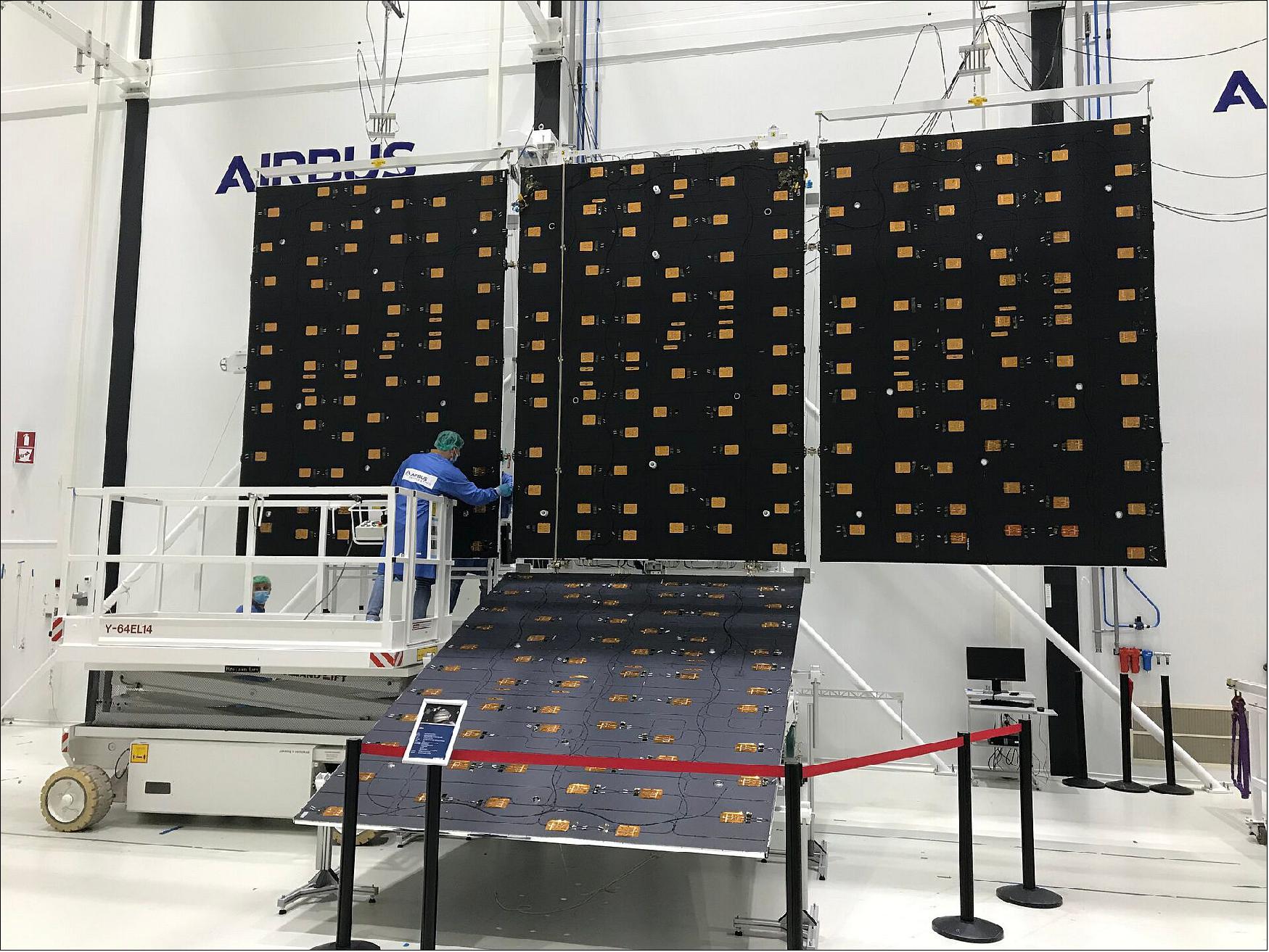 JUICE solar panels ready to turn into wings. Each panel measures about 2.5 m x 3.5 m, and with five on each side of the spacecraft, total an area of about 85 m2. They have to be folded up to fit inside the launcher, and after launch, will deploy in a distinctive cross-like formation (image credit: Airbus Defence and Space Netherlands)