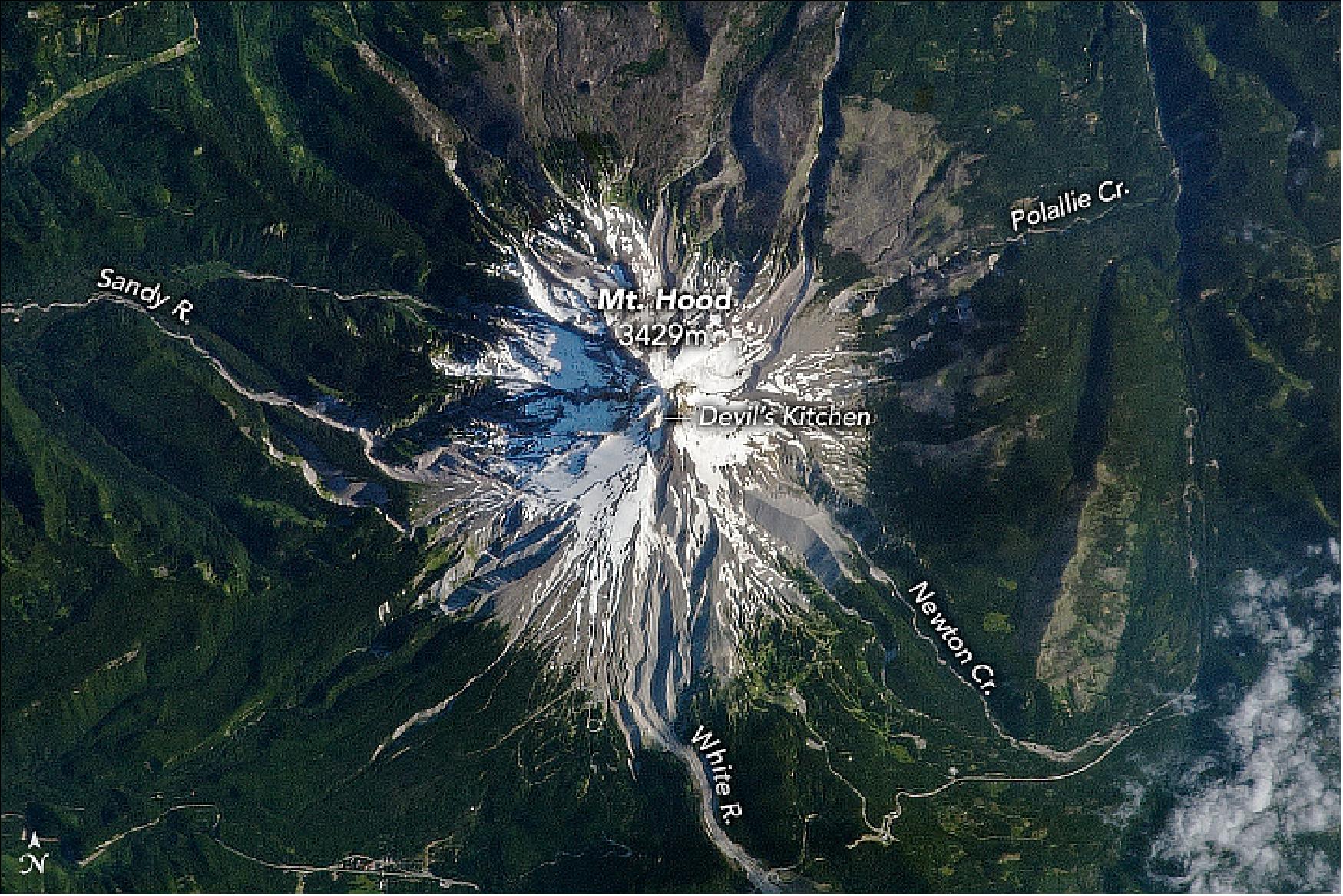 Figure 42: By the time thru-hikers reach northern Oregon, they have passed plenty of volcanoes, but they’re not out of the Cascade Arc yet. This is where the trail crosses the flanks of Mt. Hood—the state’s tallest peak. This stratovolcano is shown from the vantage point of an astronaut on the International Space Station (image credit: NASA Earth Observatory, image by Joshua Stevens and Robert Simmon, using the astronaut photograph ISS036-E-23847,provided by the ISS Crew Earth Observations Facility and the Earth Science and Remote Sensing Unit, Johnson Space Center. Story by Kathryn Hansen)