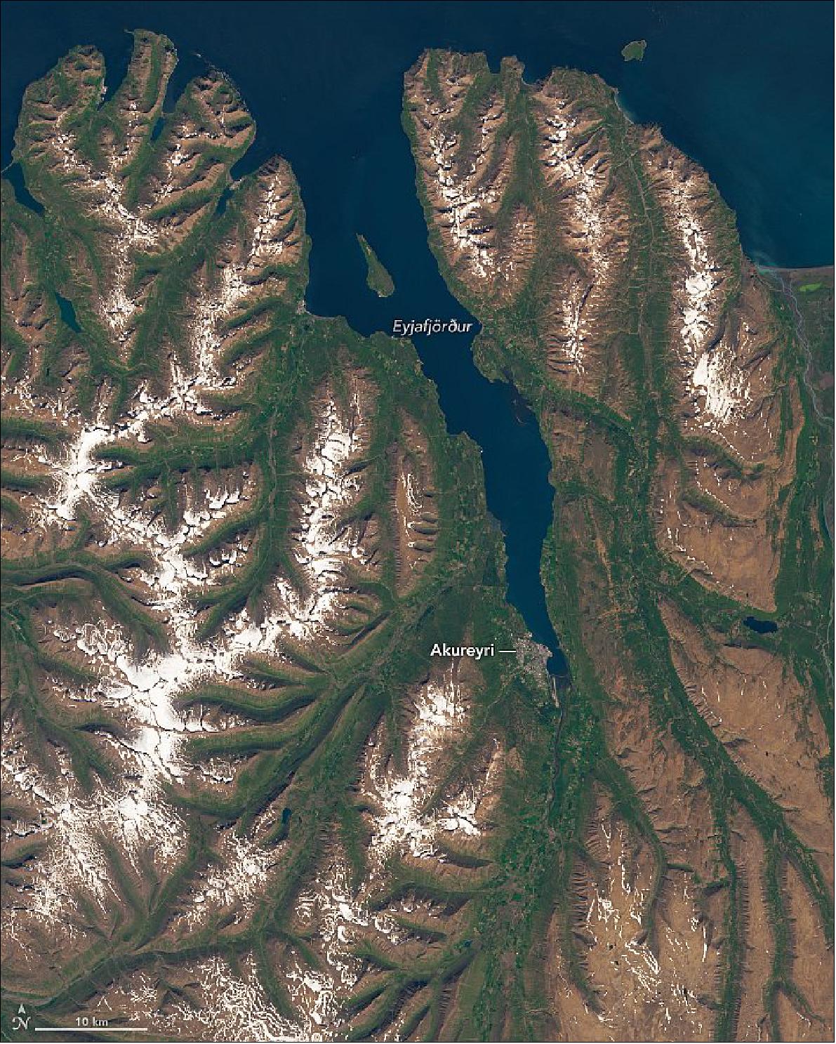 Figure 94: Eyjafjörður spans more than 60 km (40 miles) from its mouth to Akureyri, a city known as Iceland’s “northern capital.” The Operational Land Imager (OLI) on Landsat-8 acquired this image of the fjord on July 8, 2017 (image credit: NASA Earth Observatory, image by Lauren Dauphin, using Landsat data from the U.S. Geological Survey. Story by Adam Voiland)