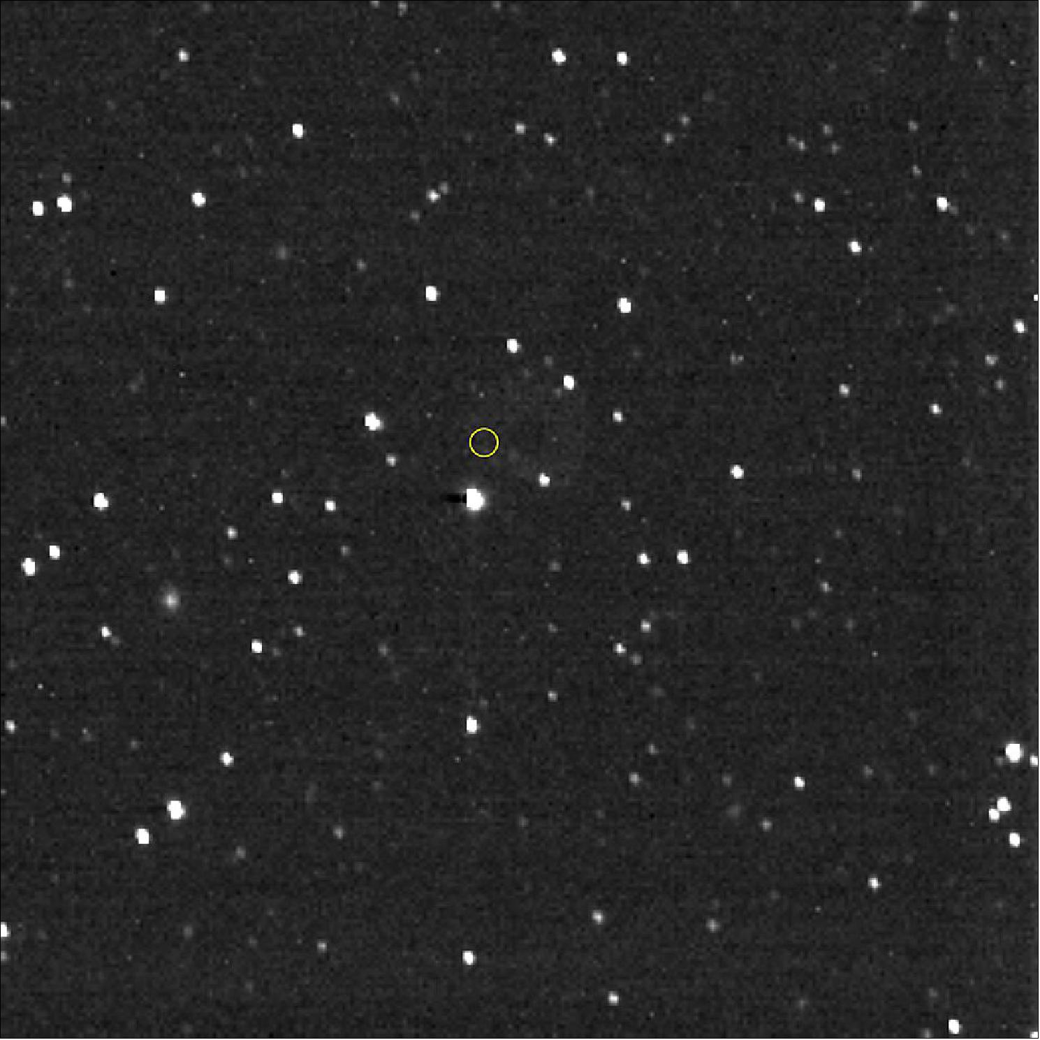 Figure 18: Hello, Voyager! From the distant Kuiper Belt at the solar system’s frontier, on Christmas Day, Dec. 25, 2020, NASA’s New Horizons spacecraft pointed its Long Range Reconnaissance Imager in the direction of the Voyager 1 spacecraft, whose location is marked with the yellow circle. Voyager 1, the farthest human-made object and first spacecraft to actually leave the solar system, is more than 152 astronomical units (AU) from the Sun—about 14.1 billion miles or 22.9 billion km—and was 11.2 billion miles (18 billion km) from New Horizons when this image was taken. Voyager 1 itself is about 1 trillion times too faint to be visible in this image. Most of the objects in the image are stars, but several of them, with a fuzzy appearance, are distant galaxies. New Horizons reaches the 50 AU mark on April 18, 2021, and will join Voyagers 1 and 2 in interstellar space in the 2040s (image credits: NASA/Johns Hopkins APL/Southwest Research Institute)