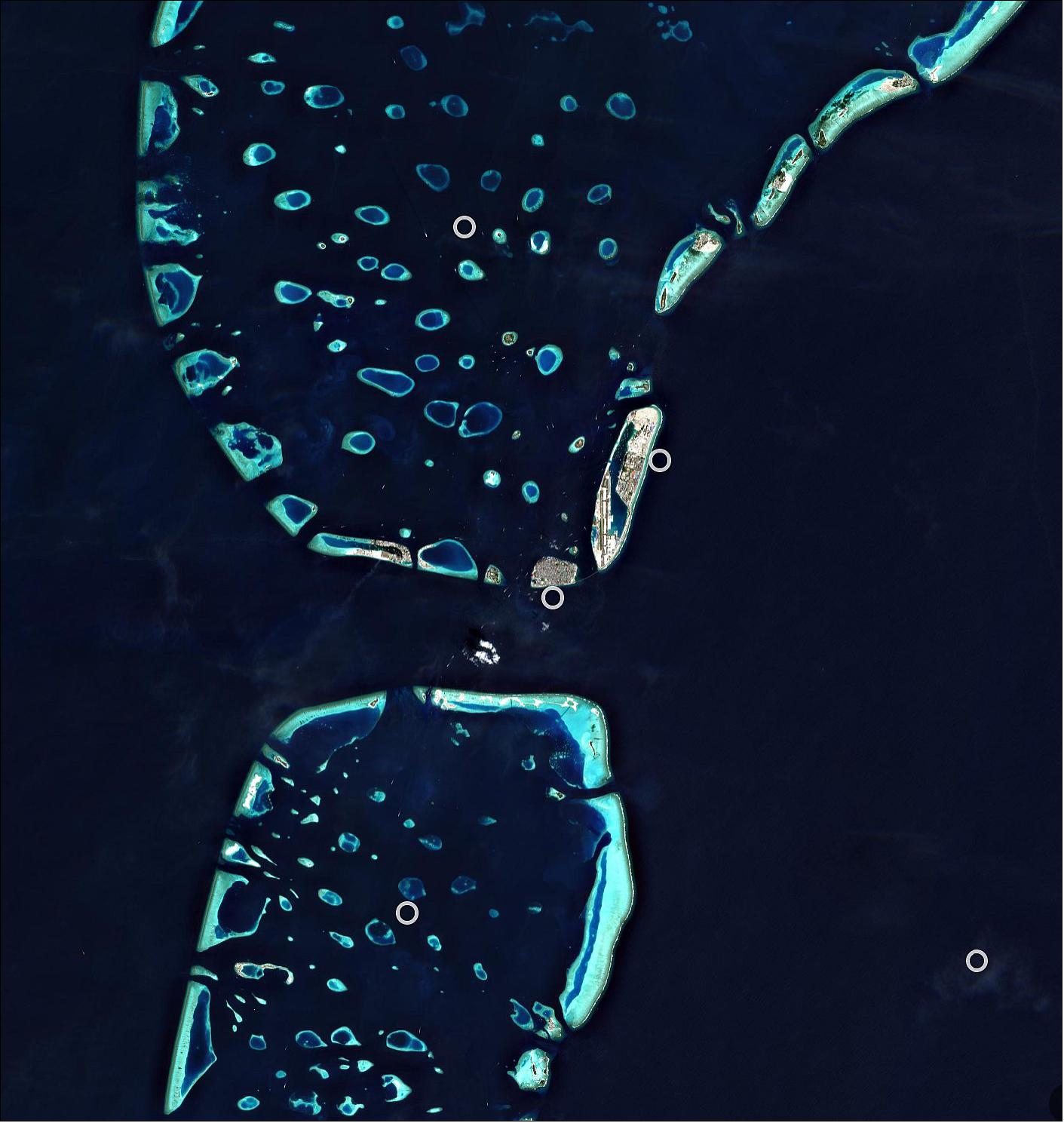 Figure 29: Malé, located at the southern edge of the North Malé Atoll, can be easily spotted in the right of the image. The island is small enough to walk around in approximately one hour, with most sights concentrated on its northern shore. Malé is both a trade and tourist centre, connected with Sri Lanka and India by steamship lines, with several vessels visible in the image. This image, also featured on the Earth from Space video program, was captured by the Copernicus Sentinel-2 mission – a two-satellite mission to supply the coverage and data delivery needed for Europe’s Copernicus program (image credit: ESA, the image contains modified Copernicus Sentinel data (2019), processed by ESA, CC BY-SA 3.0 IGO)