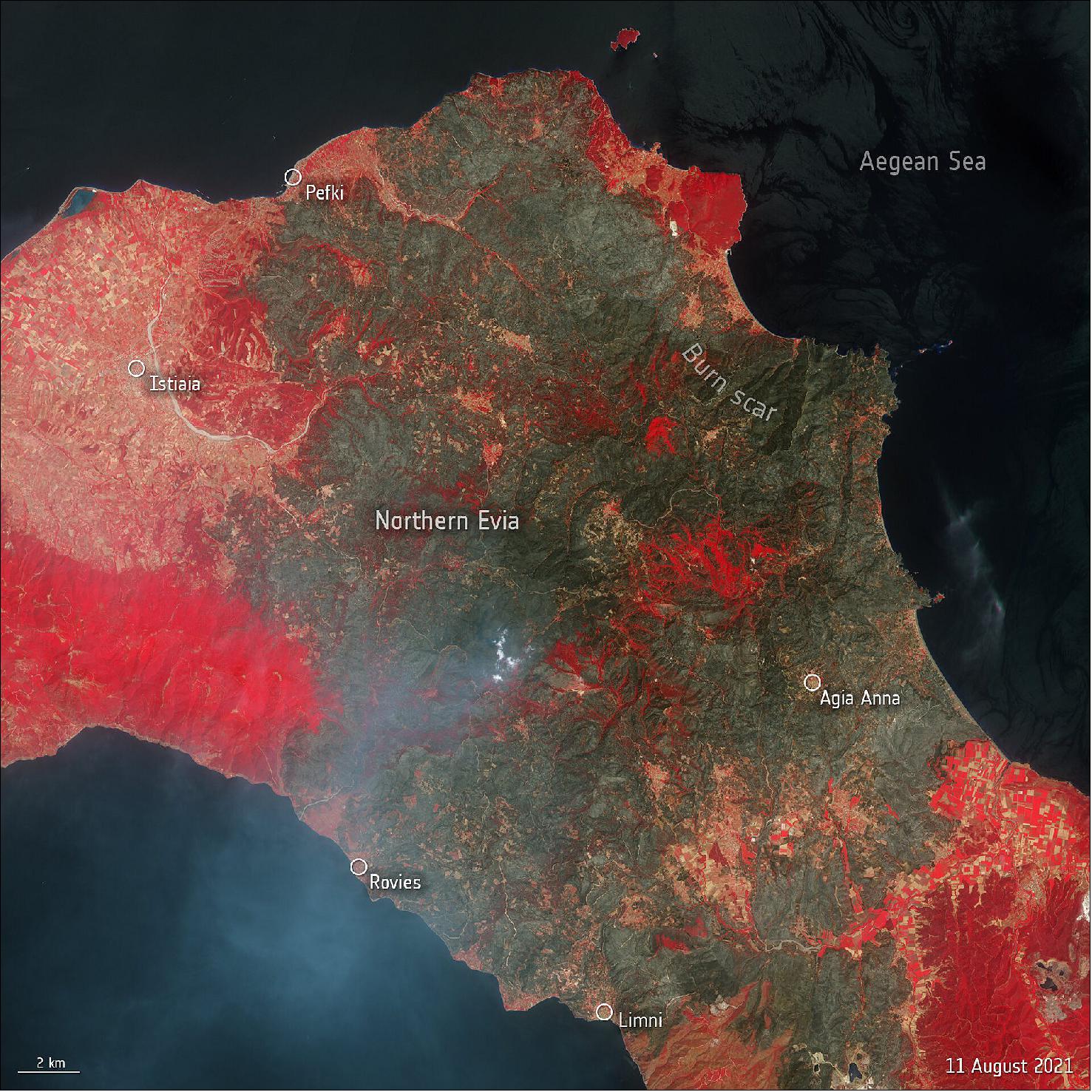 Figure 28: This false-color Copernicus Sentinel-2 image was captured yesterday on 11 August, and has been processed in a way that included the near-infrared channel which is usually used to highlight vegetation (visible in bright red). The image shows the extent of the burned area (visible in shades of brown and green) in the northern part of the island which has suffered the most damage, with an estimated 50,000 hectares lost (image credit: ESA, the image contains modified Copernicus Sentinel data (2021), processed by ESA, CC BY-SA 3.0 IGO)