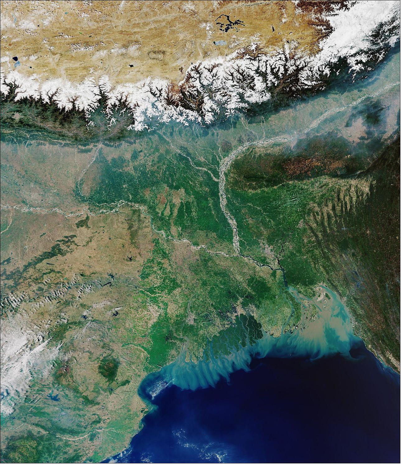 Figure 43: The river bed of the Ganges can be seen in the left of the image, while Brahmaputra can be seen to the right. The snow-covered Himalayas can be seen at the top of the image. This image of Sentinel-3, captured on 31 March 2020, is also featured on the Earth from Space video program (image credit: ESA the image contains modified Copernicus Sentinel data (2020), processed by ESA, CC BY-SA 3.0 IGO)