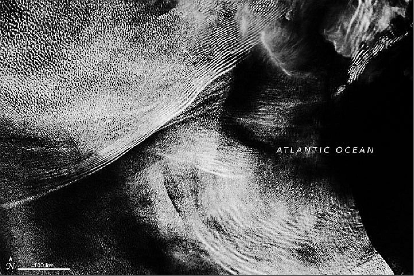 Figure 17: This nighttime detail image, acquired on May 10 with the VIIRS instrument on Suomi NPP, show gravity wave clouds off the coast of Angola. The VIIRS “day-night band” detects light in a range of wavelengths from green to near-infrared and uses filtering techniques to enhance dim signals such as gas flares, auroras, wildfires, and reflected moonlight (image credit: NASA Earth Observatory) .