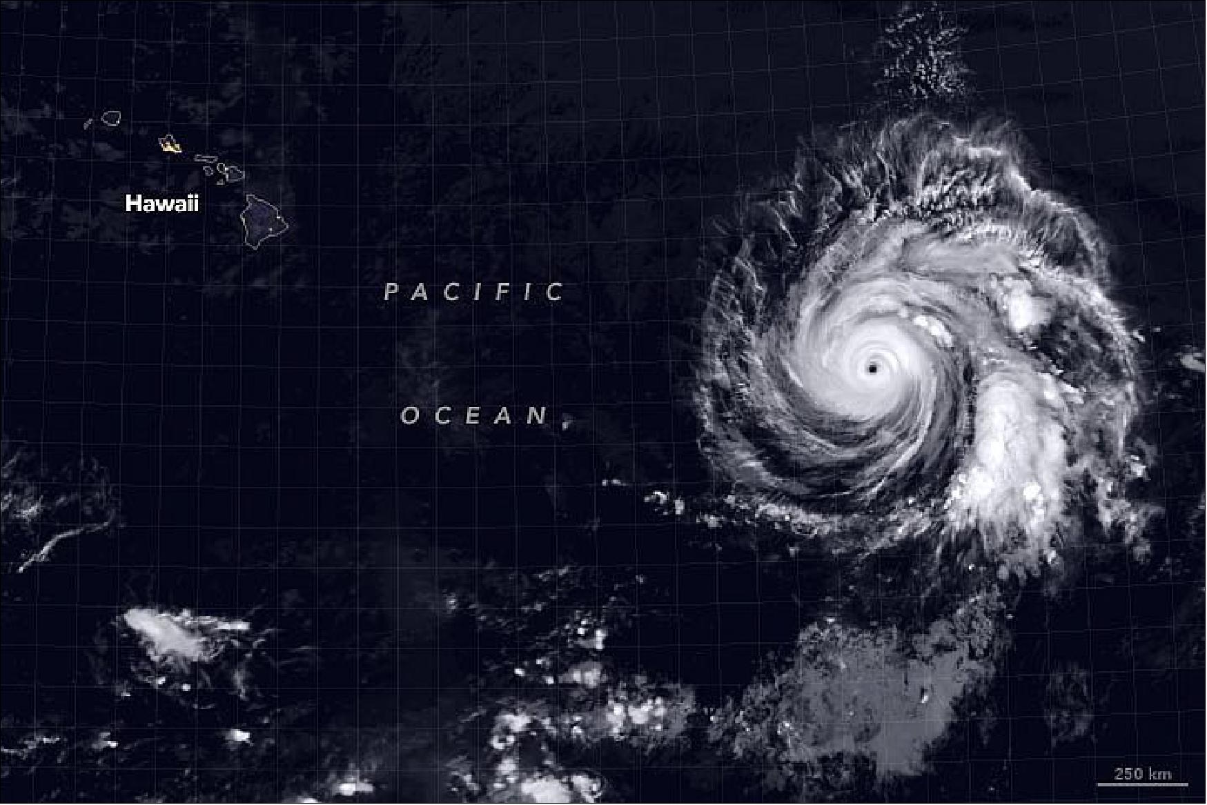 Figure 14: The image shows Douglas on July 23, 2020, at approximately 9:45 p.m. Hawaiian Standard Time. Clouds are shown in infrared using brightness temperature data, which is useful for distinguishing cooler cloud structures from the warmer surface below, from the MODIS instrument on NASA’s Terra satellite. The image is overlaid with composite imagery of city lights from NASA’s Black Marble data. As of the morning of July 24, Douglas was a category 3 hurricane with maximum sustained winds near 120 miles (195 km) per hour (image credit: NASA Earth Observatory, image by Joshua Stevens, using VIIRS day-night band data from the Suomi National Polar-orbiting Partnership and MODIS data from NASA EOSDIS/LANCE and GIBS/Worldview. Story by Kasha Patel)