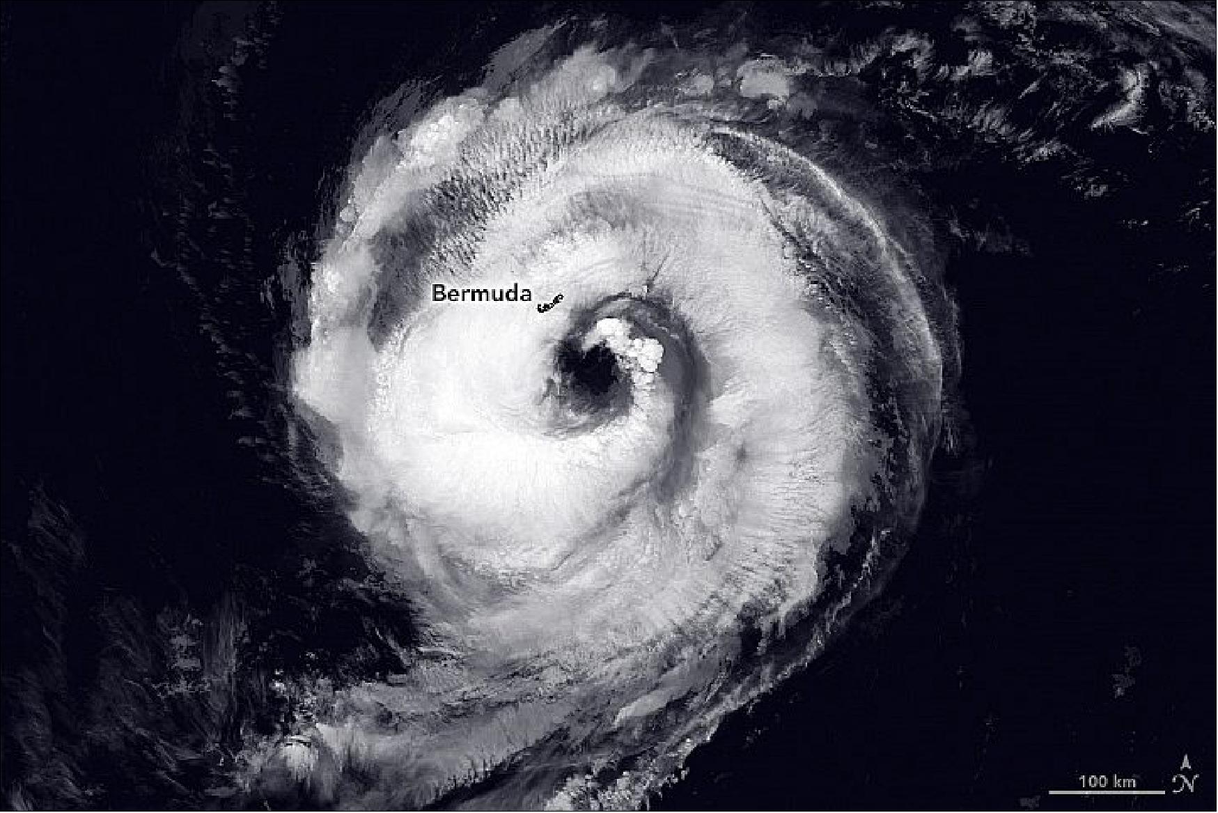 Figure 8: This image shows the strongest of the five current storms, Hurricane Paulette. On the morning of September 14, the eye of the hurricane passed directly over Bermuda with maximum sustained winds of 150 kilometers (90 miles) per hour. The Visible Infrared Imaging Radiometer Suite (VIIRS) on the Suomi NPP satellite acquired this image of Hurricane Paulette at 2:30 a.m. Atlantic Daylight Time on September 14, 2020, just hours before the storm reached the island. Clouds are shown in infrared using brightness temperature data, which is useful for distinguishing cooler cloud structures from the warmer surface below (image credit: NASA Earth Observatory images by Lauren Dauphin, using VIIRS day-night band data from the Suomi NPP and MODIS data from NASA EOSDIS/LANCE and GIBS/Worldview. Story by Kasha Patel)