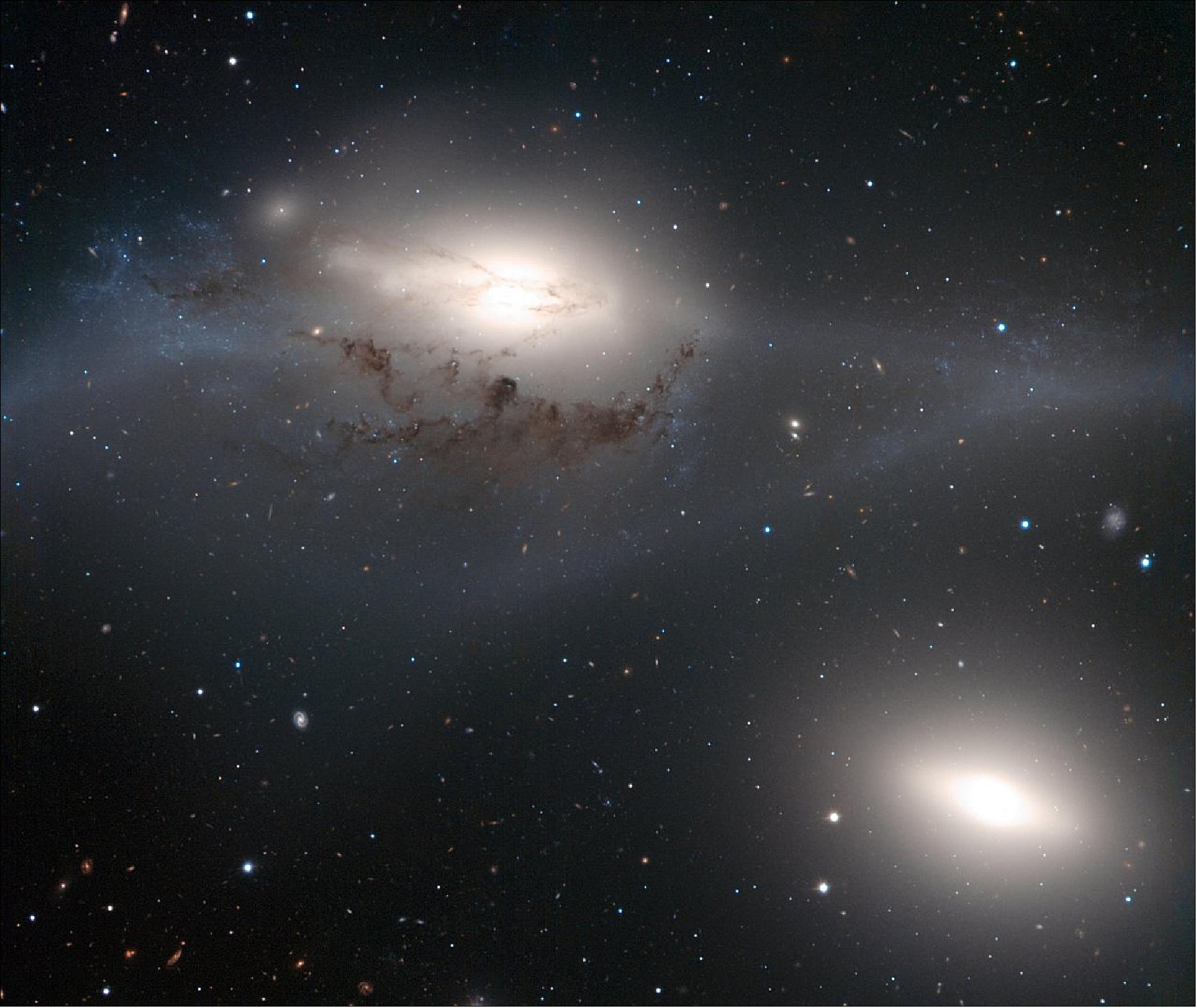 Figure 83: ESO’s Very Large Telescope has taken a striking image of a beautiful yet peculiar pair of galaxies nicknamed The Eyes. The larger of these, NGC 4438, was once a spiral galaxy but has become badly deformed by collisions with other galaxies in the last few hundred million years. This picture is the first to come out of ESO’s Cosmic Gems program, an initiative in which ESO has granted dedicated observing time for outreach purposes (image credit: ESO)