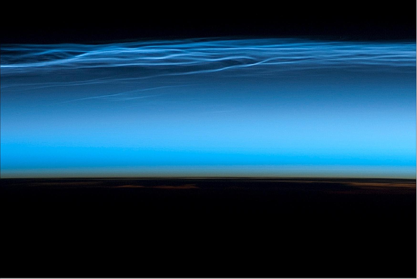 Figure 20: Astronauts on board the ISS took this picture of noctilucent clouds near the top of Earth's atmosphere on July 13, 2012 Image credit: HU, NASA)