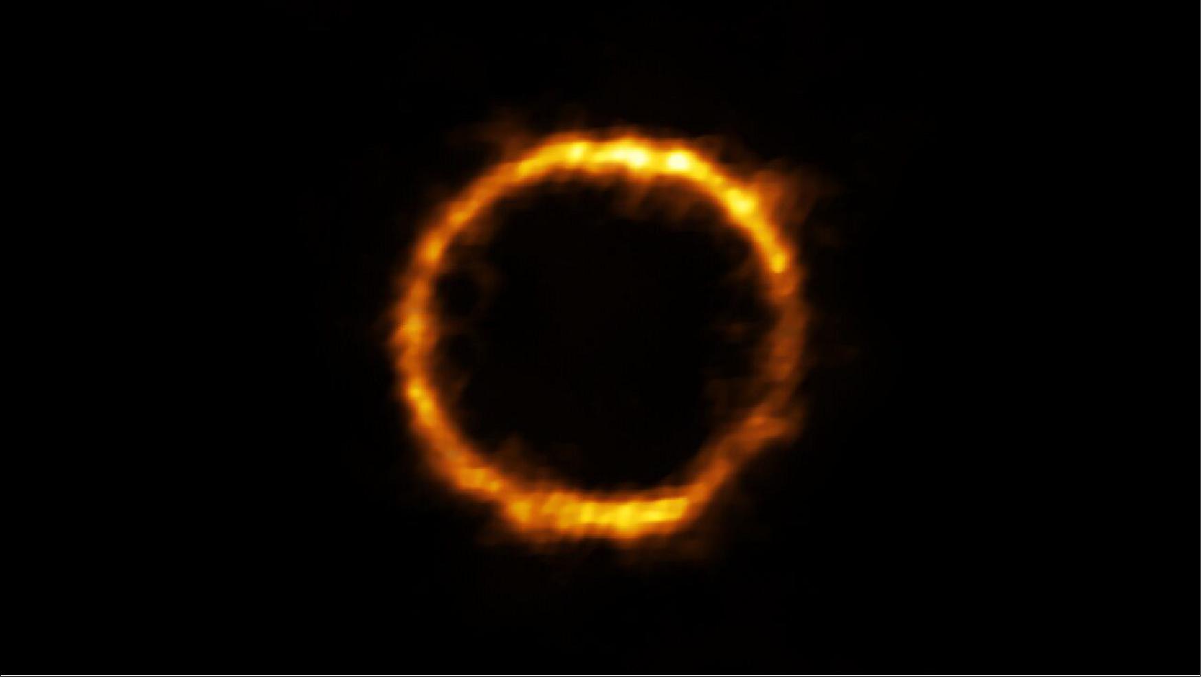 Figure 53: Astronomers using ALMA, in which the ESO is a partner, have revealed an extremely distant galaxy that looks surprisingly like our Milky Way. The galaxy, SPT0418-47, is gravitationally lensed by a nearby galaxy, appearing in the sky as a near-perfect ring of light (image credit: ALMA (ESO/NAOJ/NRAO), Rizzo et al.)