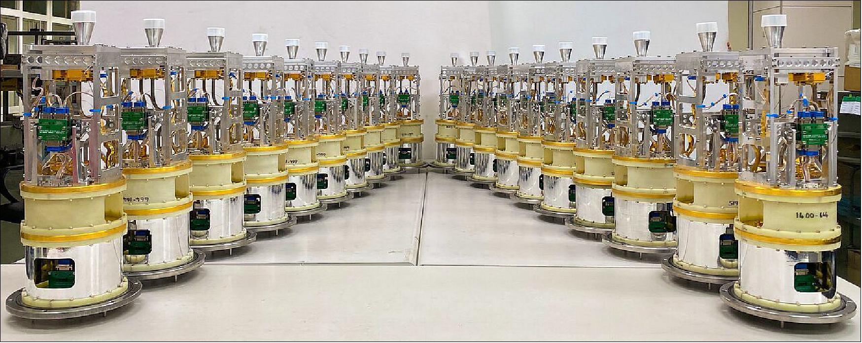 Figure 31: In this image, twenty of the cold cartridges of the band 1 receivers are lined up at the Front-end Testing Lab in Taichung, Taiwan, ready to be taken to Chile and installed on ALMA (Atacama Large Millimeter/submillimeter Array). The band 1 receivers pick up radio waves between 6 and 8.5 mm in length, the longest wavelength that ALMA is able to measure (image credit: ASIAA)