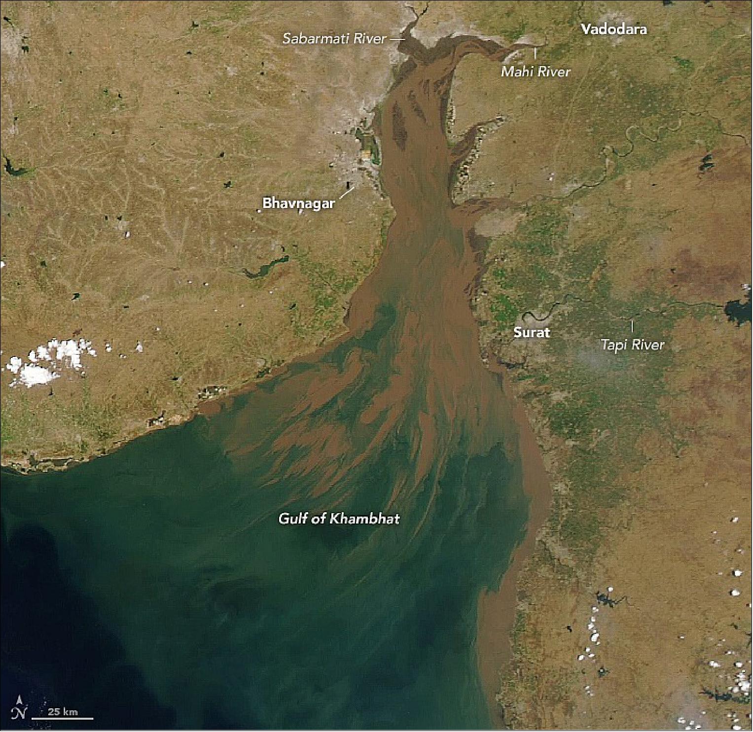 Figure 42: This image was acquired on 16 October 2021. The Gujarat coast experiences the highest tides anywhere along the Indian coastline, and the funnel shape of the 145-km (90-mile) long Gulf of Khambhat amplifies them. As incoming tides are constricted by the narrowing gulf, they increase in height. At Bhavnagar, the maximum neap tide height is 10 meters (33 feet) while the maximum spring tide height is 11.6 meters (38 feet)—some of the largest tidal ranges in the world (image credit: NASA Earth Observatory images by Lauren Dauphin, using MODIS data from NASA EOSDIS LANCE and GIBS/Worldview. Story by Sara E. Pratt)