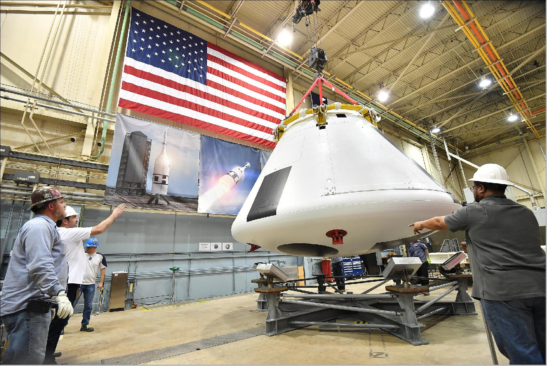 Figure 65: Technicians lower the crew module for Ascent Abort-2 onto a stand at Johnson Space Center in Houston on March 2 (image credit: NASA, Robert Markowitz)