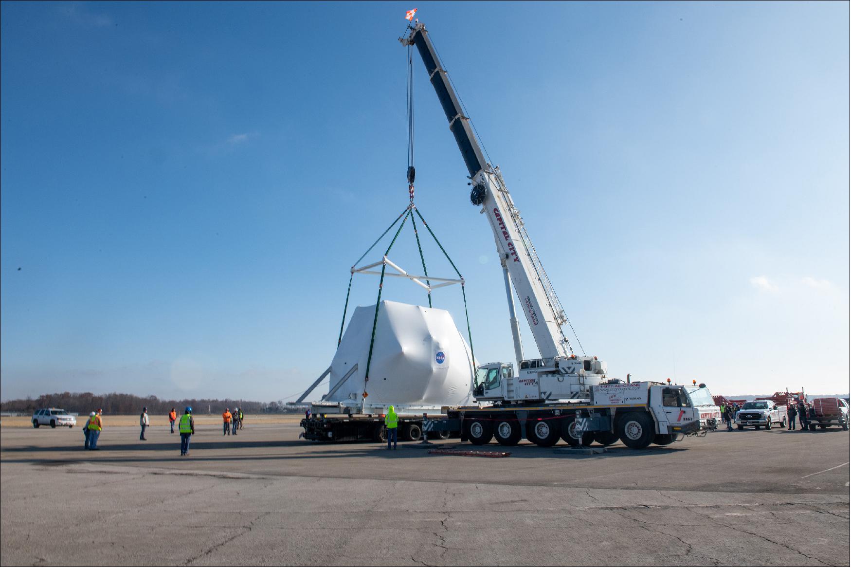 Figure 51: The Orion spacecraft being lifted onto the truck for transport to NASA's Plum Brook Station (image credit: NASA)